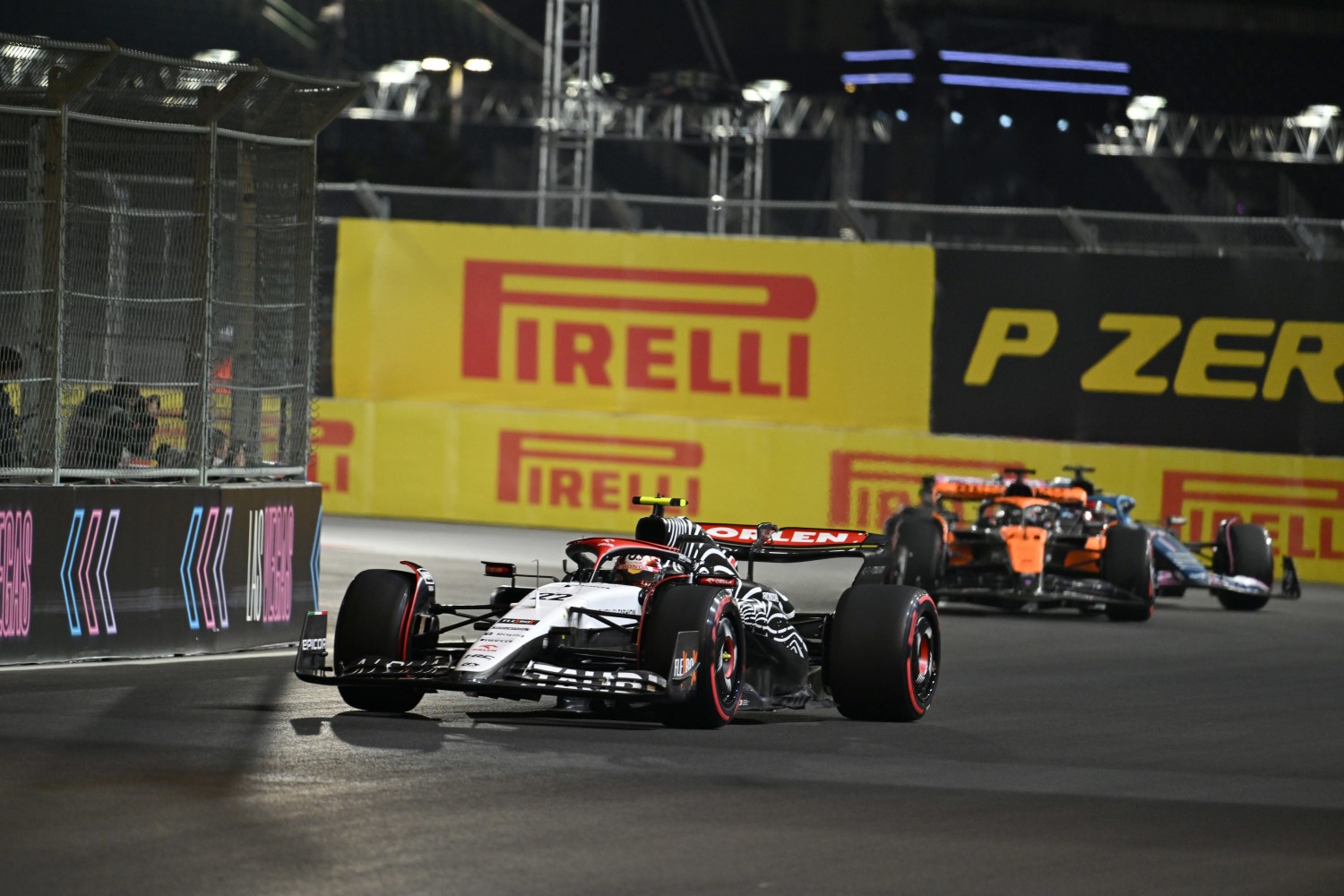 Yuki Tsunoda, AlphaTauri AT04, leads Oscar Piastri, McLaren MCL60, and Esteban Ocon, Alpine A523 during the Las Vegas GP at Streets of Las Vegas on Thursday November 16, 2023, United States of America. (Photo by Simon Galloway / LAT Images)