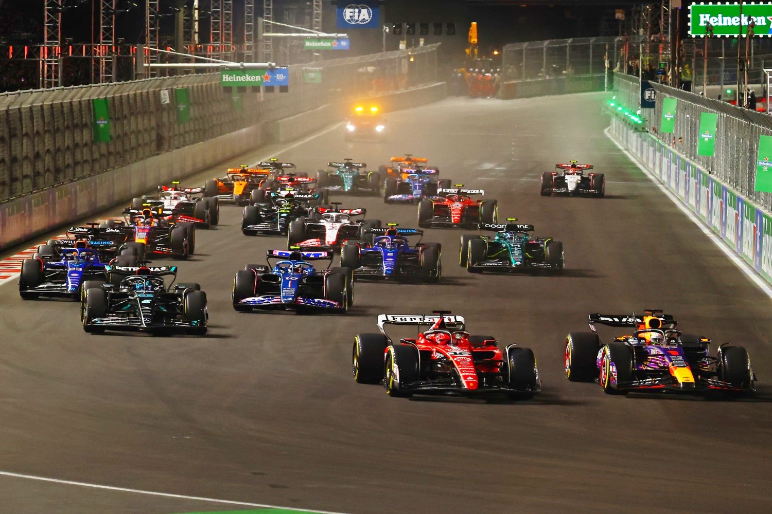 Max Verstappen of the Netherlands driving the (1) Oracle Red Bull Racing RB19 leads Charles Leclerc of Monaco driving the (16) Ferrari SF-23 at turn one during the F1 Grand Prix of Las Vegas at Las Vegas Strip Circuit on November 18, 2023 in Las Vegas, Nevada. (Photo by Mark Thompson/Getty Images) // Getty Images / Red Bull Content Pool