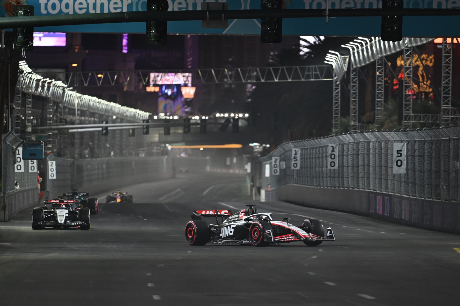 Kevin Magnussen, Haas VF-23, leads Daniel Ricciardo, AlphaTauri AT04