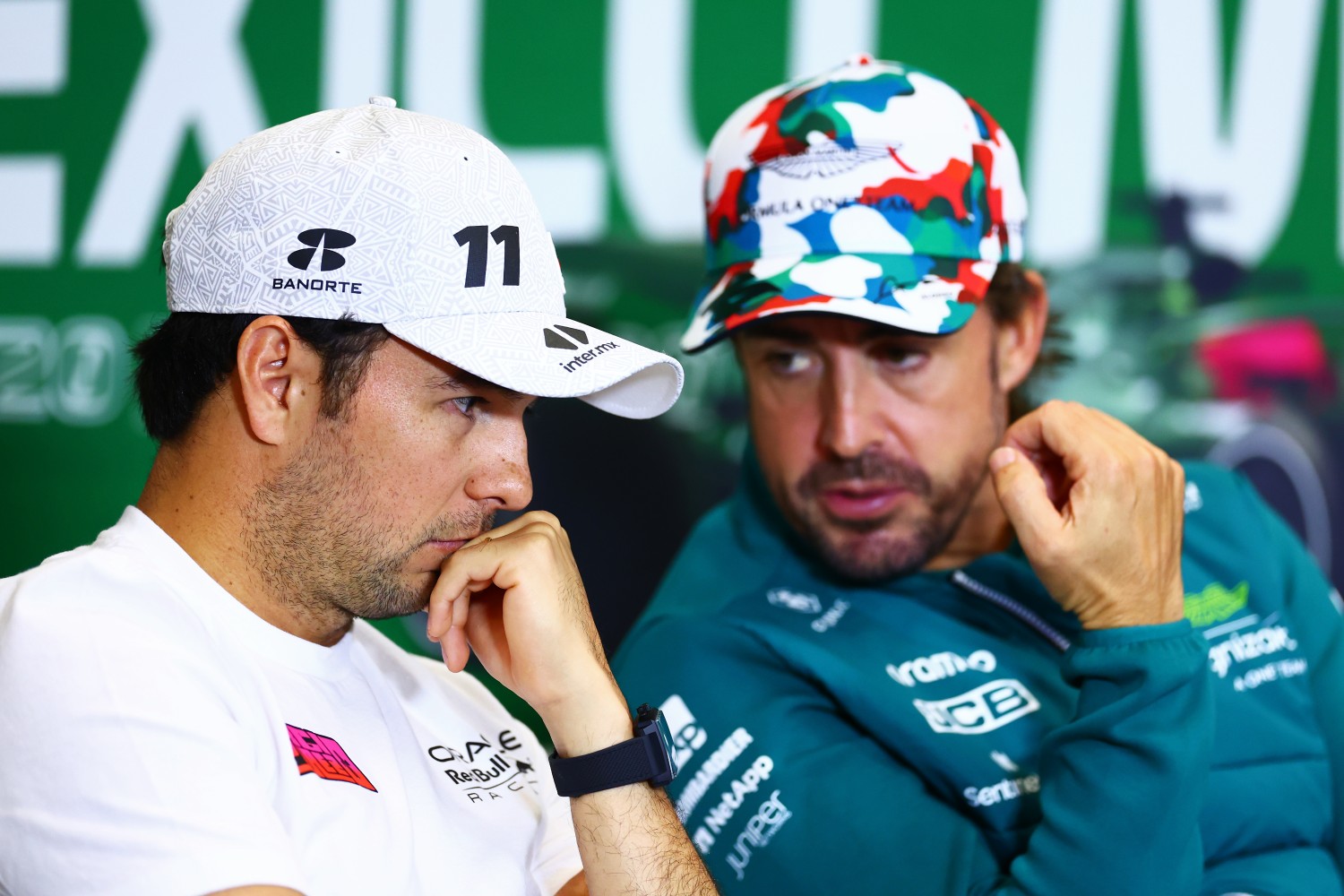 Sergio Perez of Mexico and Oracle Red Bull Racing talks with Fernando Alonso of Spain and Aston Martin F1 Team in the Drivers Press Conference during previews ahead of the F1 Grand Prix of Mexico at Autodromo Hermanos Rodriguez on October 26, 2023 in Mexico City, Mexico. (Photo by Dan Istitene/Getty Images)