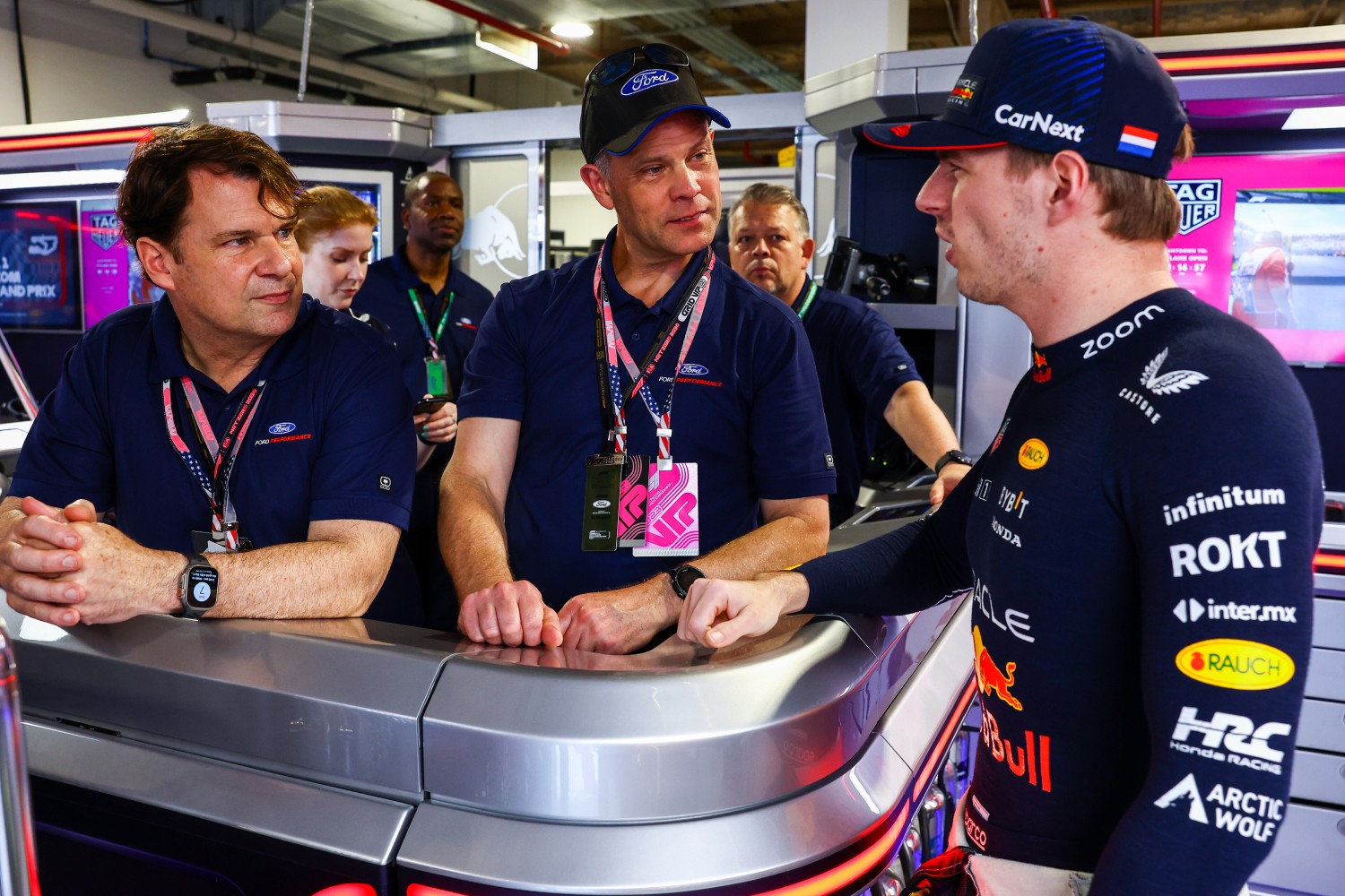 Jim Farley, CEO of Ford, Mark Rushbrook of Ford and Max Verstappen of the Netherlands and Oracle Red Bull Racing talk in the garage prior to the F1 Grand Prix of Miami at Miami International Autodrome on May 07, 2023 in Miami, Florida. (Photo by Mark Thompson/Getty Images) // Getty Images / Red Bull Content Pool
