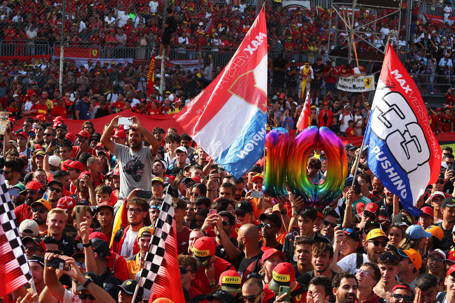 Max Verstappen of the Netherlands and Oracle Red Bull Racing fans wave flags at the podium celebrations during the F1 Grand Prix of Italy at Autodromo Nazionale Monza on September 03, 2023 in Monza, Italy. (Photo by Peter Fox/Getty Images) // Getty Images / Red Bull Content Pool