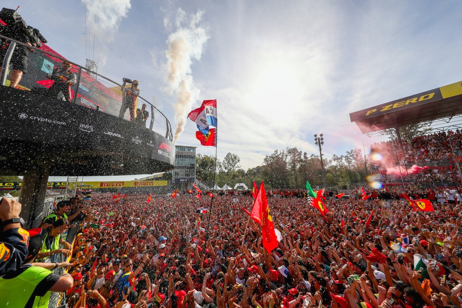 The tifosi celebrate with Max Verstappen of Red Bull Racing and The Netherlands, Sergio Perez of Mexico and Red Bull Racing and Carlos Sainz of Ferrari and Spain during the F1 Grand Prix of Italy at Autodromo Nazionale Monza on September 03, 2023 in Monza, Italy. (Photo by Peter Fox/Getty Images) // Getty Images / Red Bull Content Pool