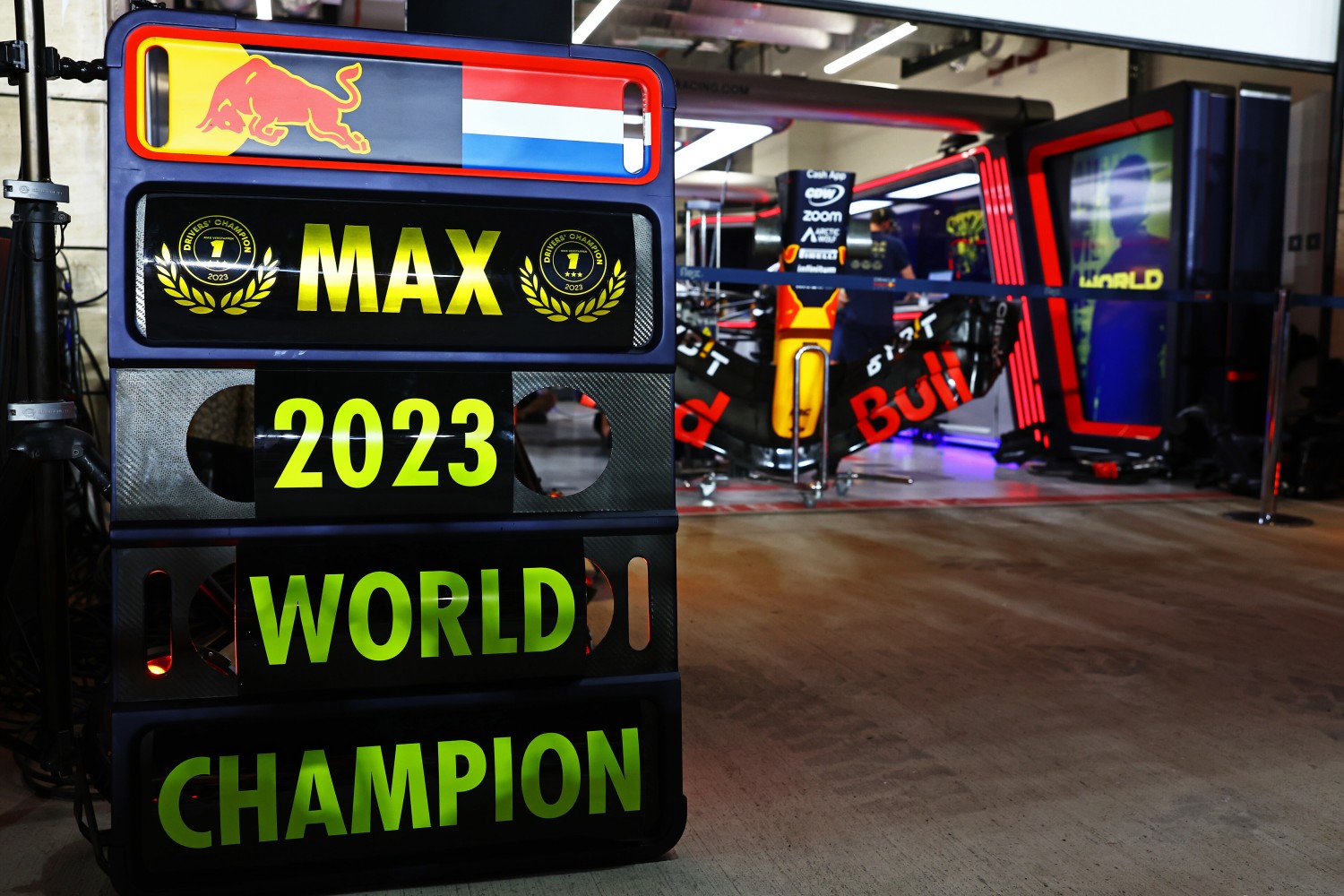 A pit board celebrating the 2023 F1 World Drivers Championship victory of Max Verstappen of the Netherlands and Oracle Red Bull Racing in the Pitlane after the Sprint ahead of the F1 Grand Prix of Qatar at Lusail International Circuit on October 07, 2023 in Lusail City, Qatar. (Photo by Mark Thompson/Getty Images) // Getty Images / Red Bull Content Pool