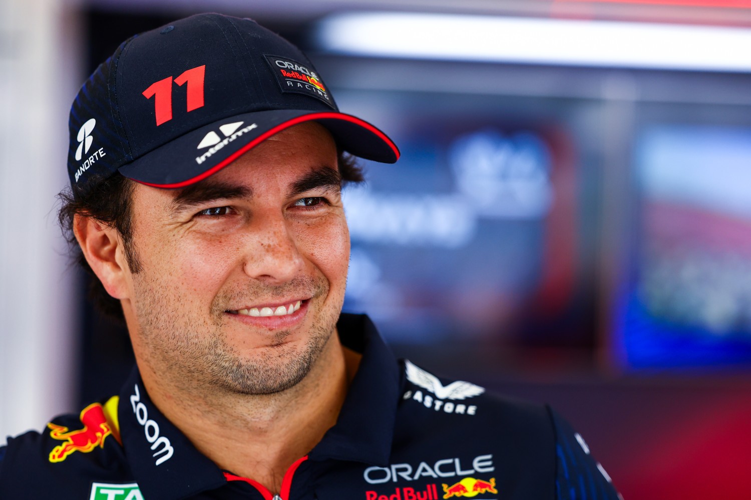Sergio Perez of Mexico and Oracle Red Bull Racing looks on in the garage during previews ahead of the F1 Grand Prix of Qatar at Lusail International Circuit on October 05, 2023 in Lusail City, Qatar. (Photo by Mark Thompson/Getty Images) // Getty Images / Red Bull Content Pool