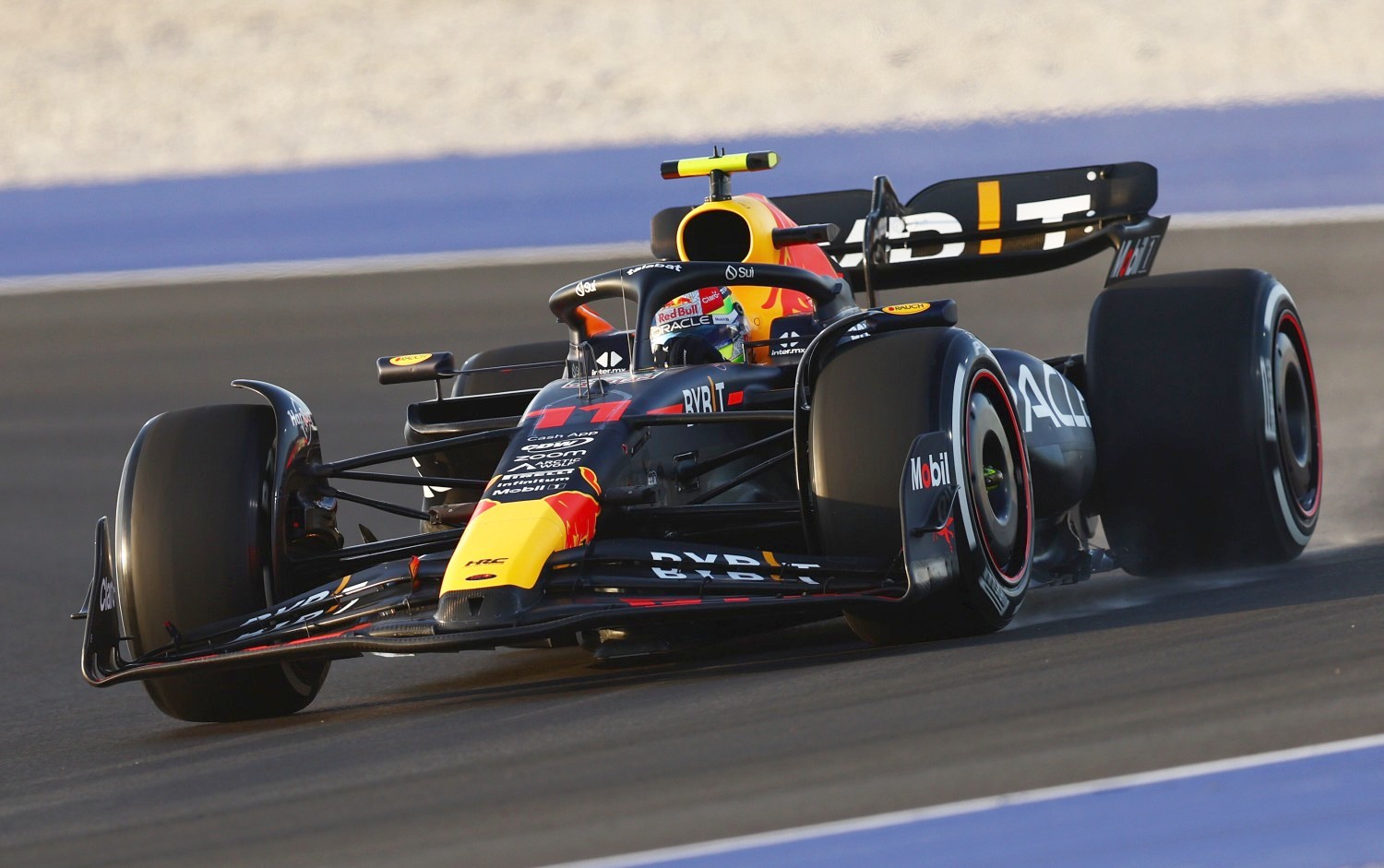 Sergio Perez of Mexico driving the (11) Oracle Red Bull Racing RB19 on track during practice ahead of the F1 Grand Prix of Qatar at Lusail International Circuit on October 06, 2023 in Lusail City, Qatar. (Photo by Clive Rose/Getty Images) // Getty Images / Red Bull Content Pool