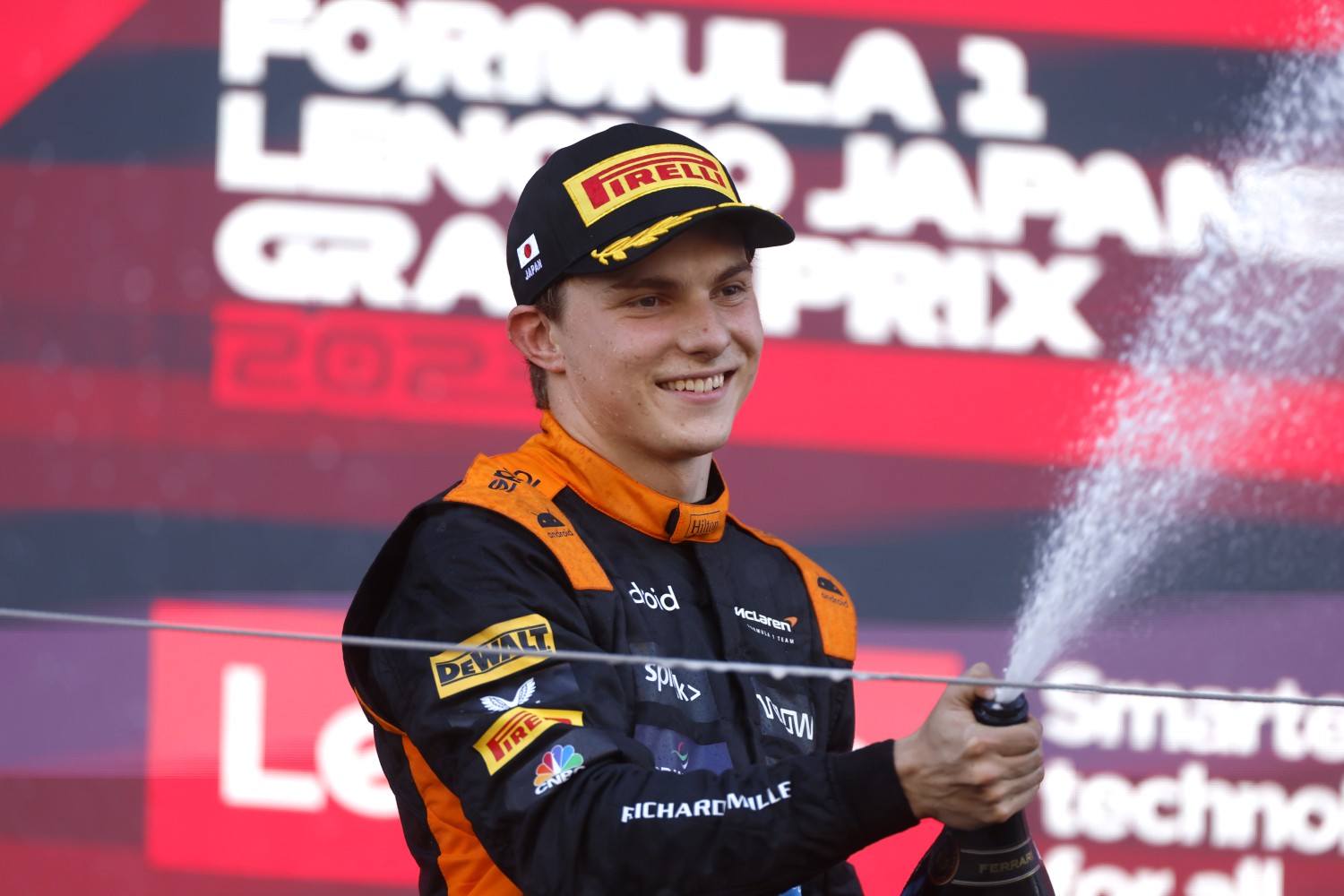 Oscar Piastri, McLaren, 2nd position, sprays Champagne on the podium