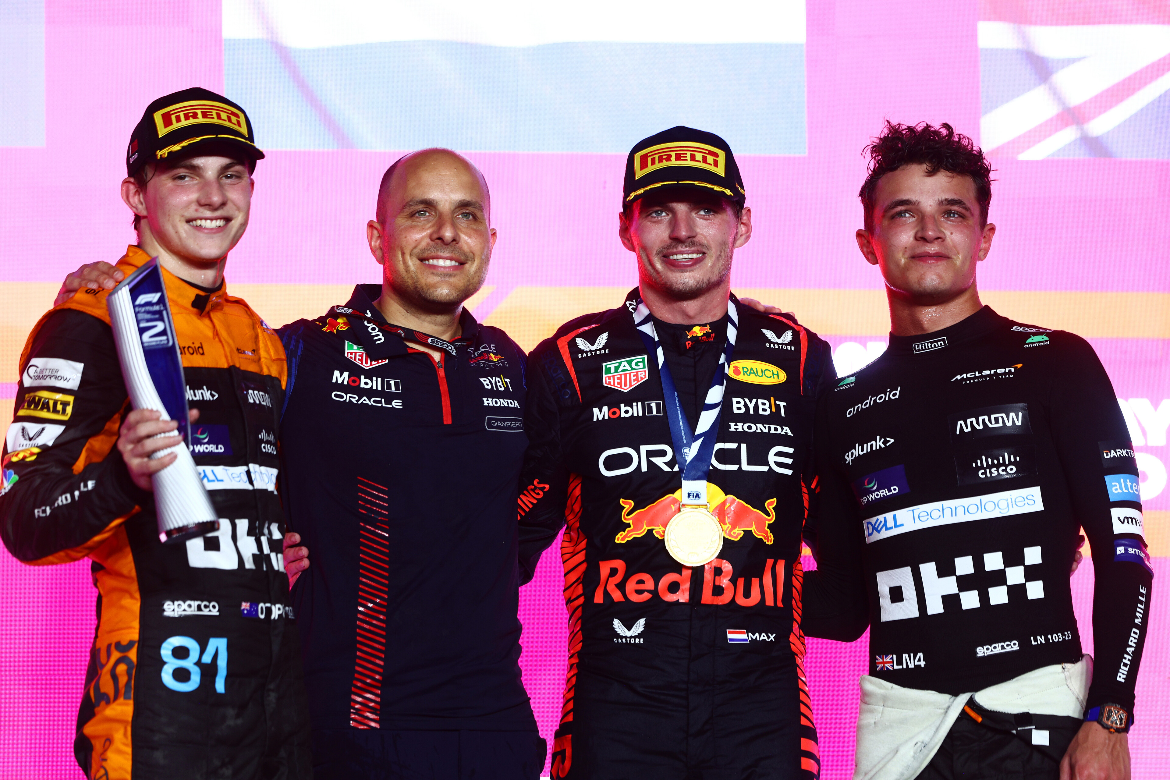 Race winner Max Verstappen of the Netherlands and Oracle Red Bull Racing, Second placed Oscar Piastri of Australia and McLaren, Third placed Lando Norris of Great Britain and McLaren and Red Bull Racing race engineer Gianpiero Lambiase celebrate on the podium during the F1 Grand Prix of Qatar at Lusail International Circuit on October 08, 2023 in Lusail City, Qatar. (Photo by Clive Rose/Getty Images) // Getty Images / Red Bull Content Pool