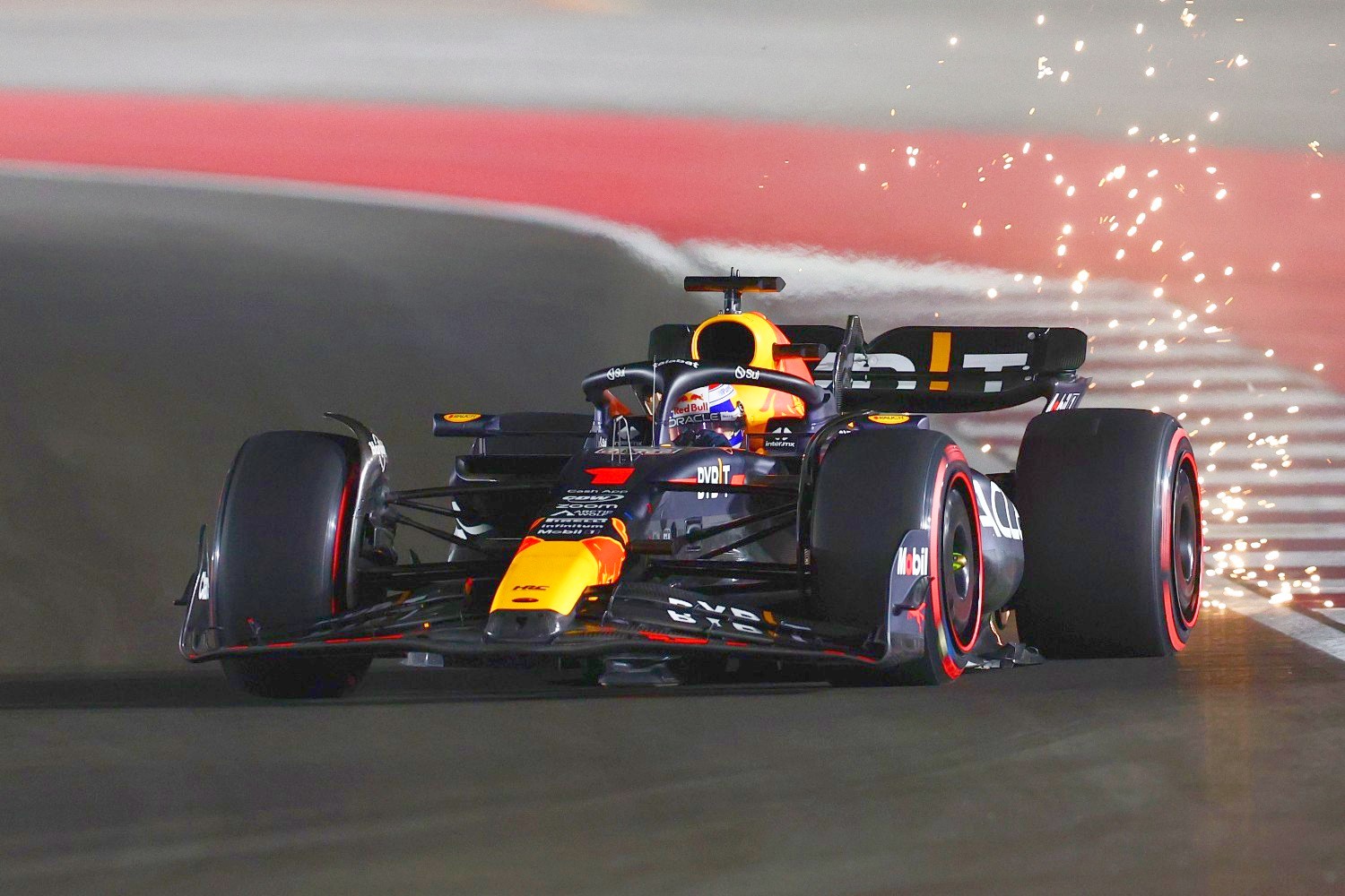 Sparks fly behind Max Verstappen of the Netherlands driving the (1) Oracle Red Bull Racing RB19 during qualifying ahead of the F1 Grand Prix of Qatar at Lusail International Circuit on October 06, 2023 in Lusail City, Qatar. (Photo by Clive Rose/Getty Images)