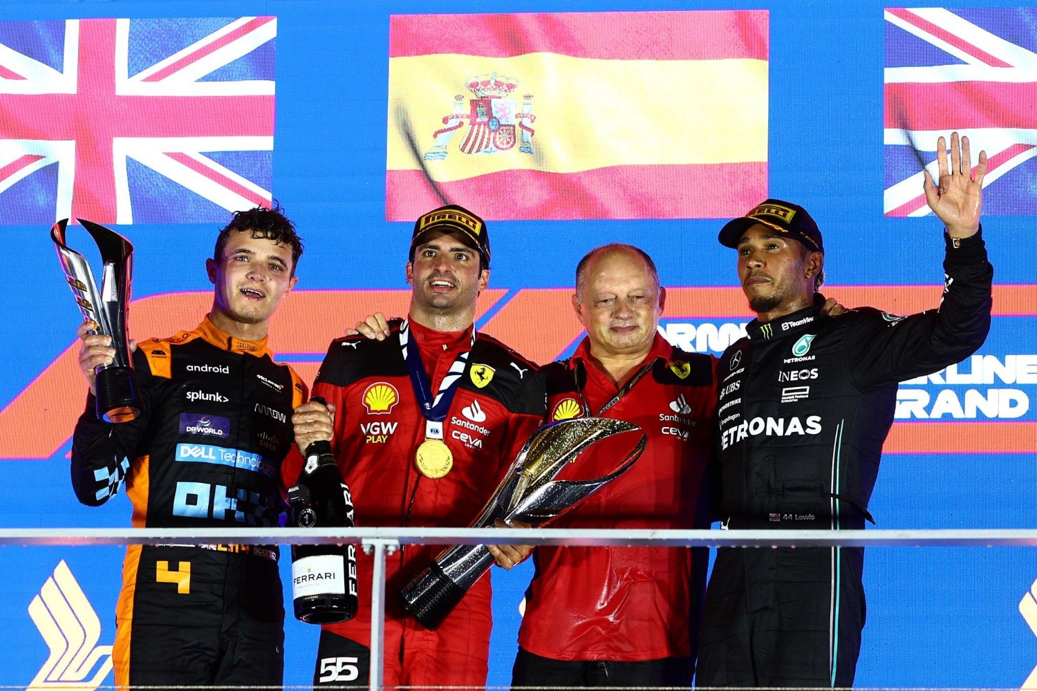 2023 Singapore GP podium (L to R) Lando Norris (2nd), Carlos Sainz Jr. (1st) Fred Vasseur and Lewis Hamilton (3rd)