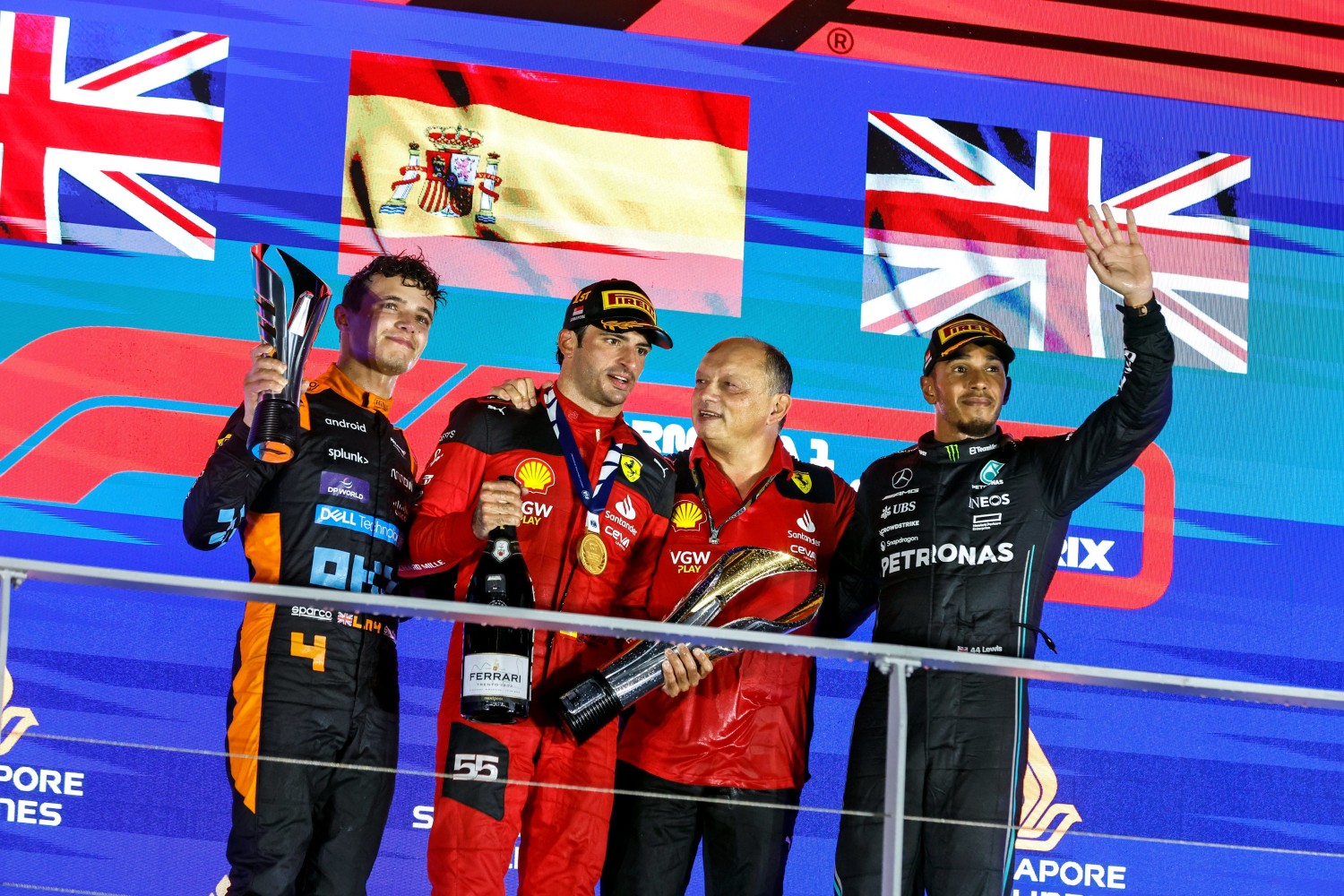 2023 Singapore GP podium (L to R) Lando Norris (2nd), Carlos Sainz Jr. (1st) Fred Vasseur and Lewis Hamilton (3rd)