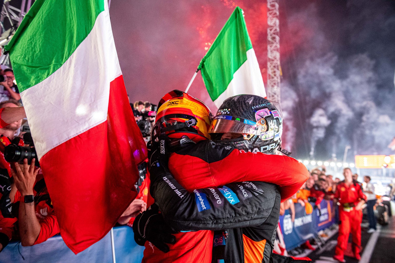 Sainz Jr. and Leclerc embrace after Ferrari win - credit: @Scuderia Ferrari Press Office