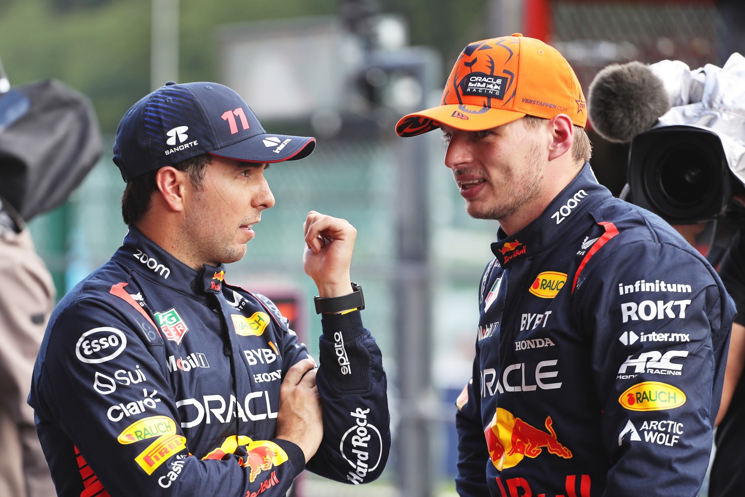 SPA, BELGIUM - JULY 28: Pole position qualifier Max Verstappen of the Netherlands and Oracle Red Bull Racing and Third placed qualifier Sergio Perez of Mexico and Oracle Red Bull Racing talk in parc ferme during qualifying ahead of the F1 Grand Prix of Belgium at Circuit de Spa-Francorchamps on July 28, 2023 in Spa, Belgium. (Photo by Peter Fox/Getty Images) // Getty Images / Red Bull Content Pool // 