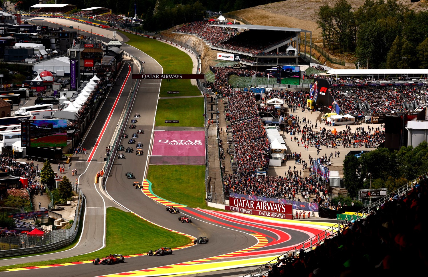 Charles Leclerc of Monaco driving the (16) Ferrari SF-23 leads Sergio Perez of Mexico driving the (11) Oracle Red Bull Racing RB19 and the rest of the field at the start during the F1 Grand Prix of Belgium at Circuit de Spa-Francorchamps on July 30, 2023 in Spa, Belgium. (Photo by Francois Nel/Getty Images) // Getty Images / Red Bull Content Pool