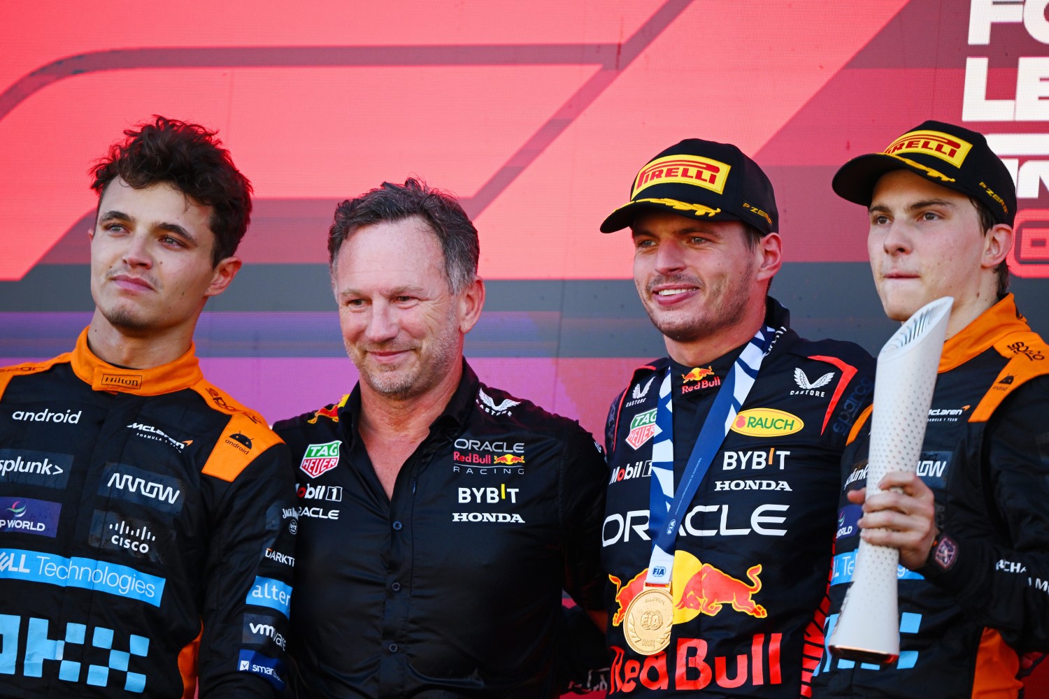 Race winner Max Verstappen of the Netherlands and Oracle Red Bull Racing, Second placed Lando Norris of Great Britain,McLaren and Third placed Oscar Piastri of Australia and McLaren and Red Bull Racing Team Principal Christian Horner celebrate on the podium during the F1 Grand Prix of Japan at Suzuka International Racing Course on September 24, 2023 in Suzuka, Japan. (Photo by Clive Mason/Getty Images) // Getty Images / Red Bull Content Pool