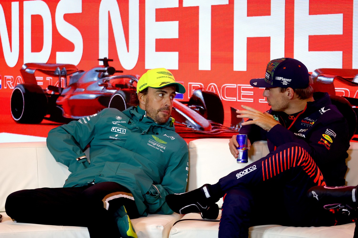 Race winner Max Verstappen of the Netherlands and Oracle Red Bull Racing and Second placed Fernando Alonso of Spain and Aston Martin F1 Team talk in the press conference after the F1 Grand Prix of The Netherlands at Circuit Zandvoort on August 27, 2023 in Zandvoort, Netherlands. (Photo by Bryn Lennon/Getty Images) // Getty Images / Red Bull Content Pool //