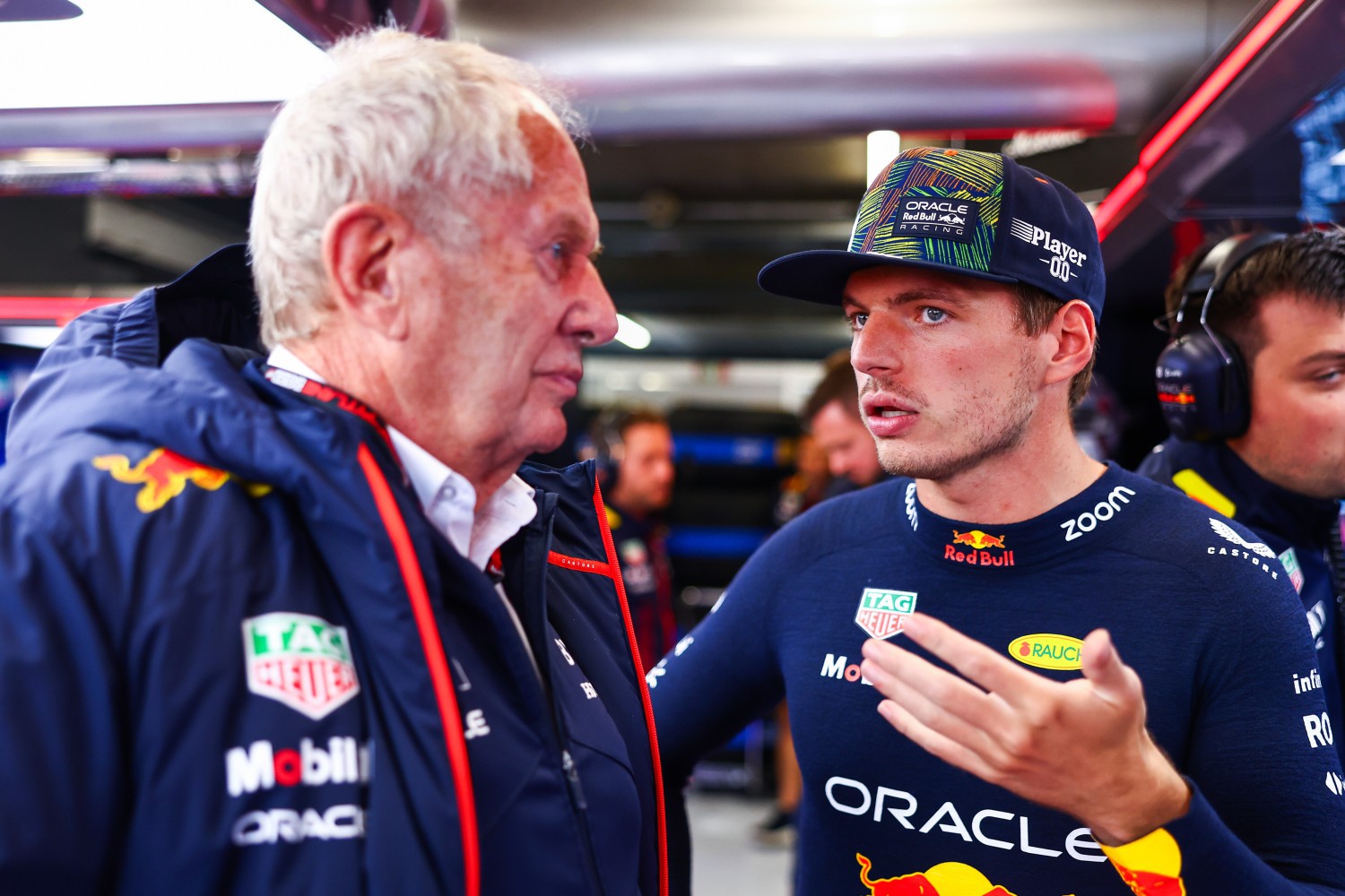 Max Verstappen of the Netherlands and Oracle Red Bull Racing talks with Red Bull Racing Team Consultant Dr Helmut Marko in the garage during qualifying ahead of the F1 Grand Prix of The Netherlands at Circuit Zandvoort on August 26, 2023 in Zandvoort, Netherlands. (Photo by Mark Thompson/Getty Images) // Getty Images / Red Bull Content Pool //