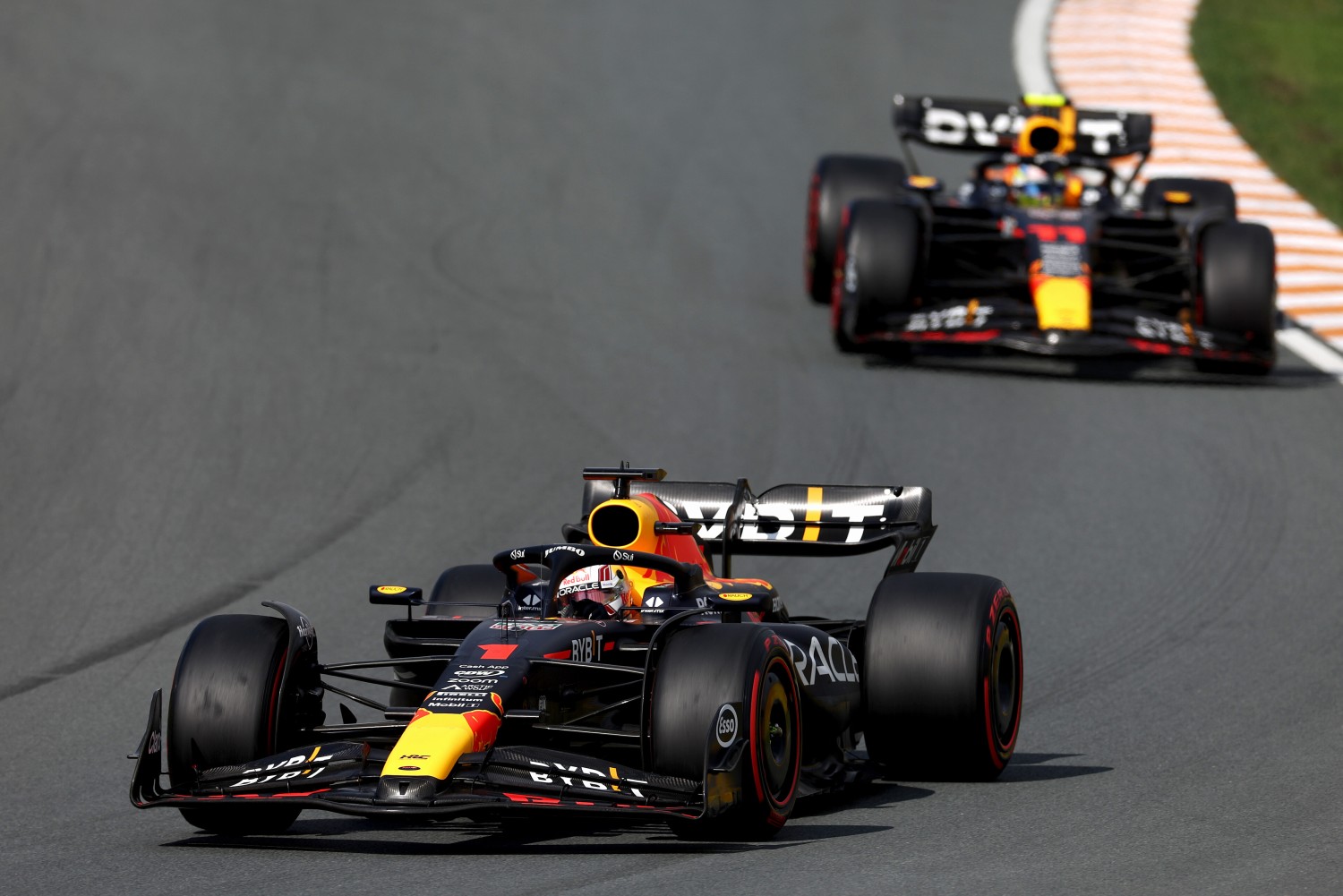 Max Verstappen of the Netherlands driving the (1) Oracle Red Bull Racing RB19 leads Sergio Perez of Mexico driving the (11) Oracle Red Bull Racing RB19 during the F1 Grand Prix of The Netherlands at Circuit Zandvoort on August 27, 2023 in Zandvoort, Netherlands. (Photo by Lars Baron/Getty Images) // Getty Images / Red Bull Content Pool