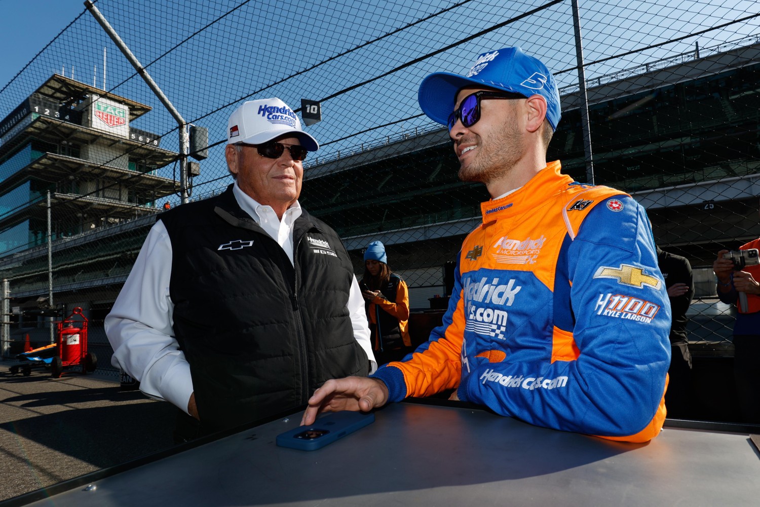 Team owner Rick Hendrick talks to Kyle Larson. Photo courtesy of Penske Entertainment.