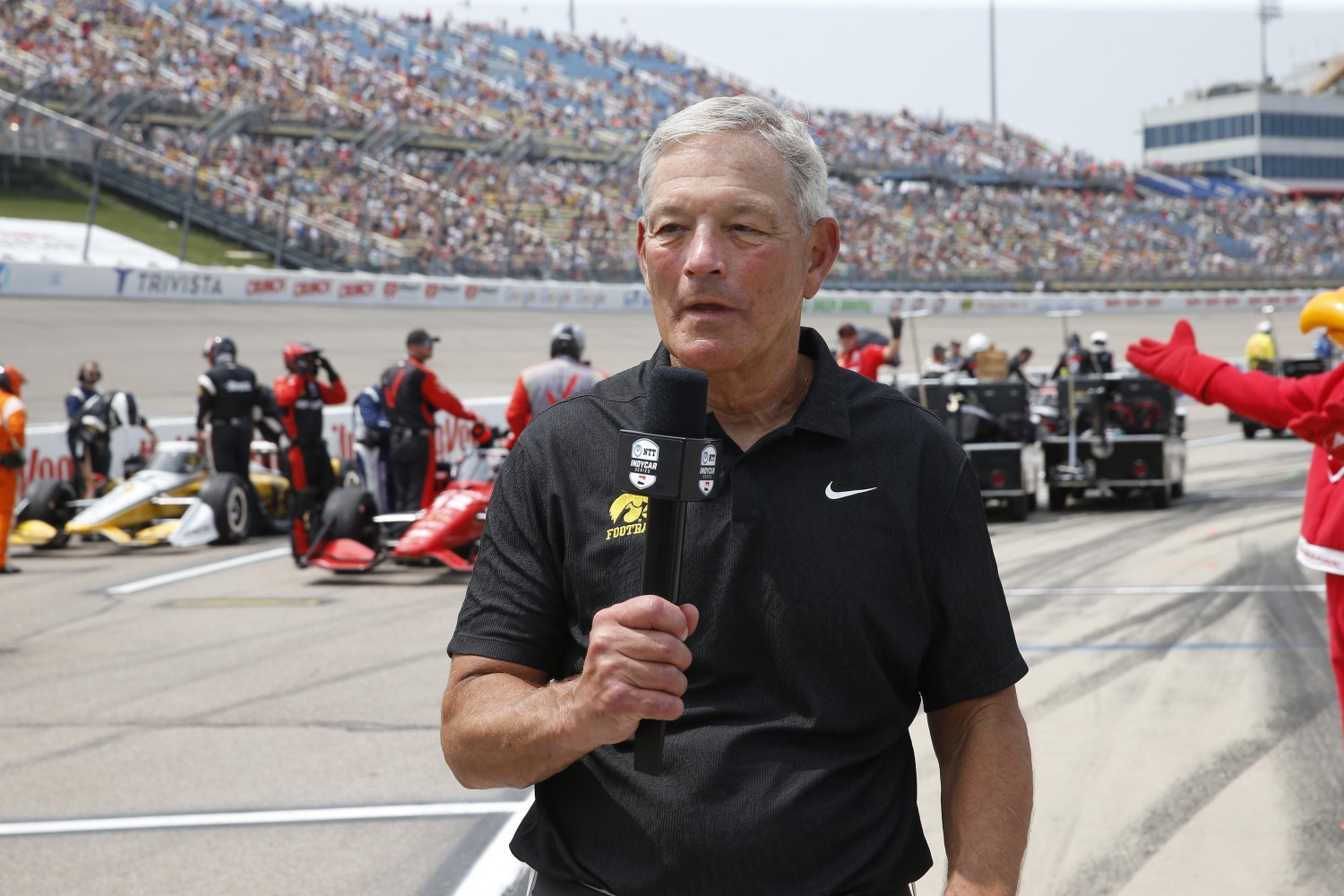 Kirk Ferentz - gives the command to start engines for the Hy-Vee One Step 250 Presented by Gatorade - By_ Chris Jones. The massive empty seats do not lie. More People came later to see the concerts.
