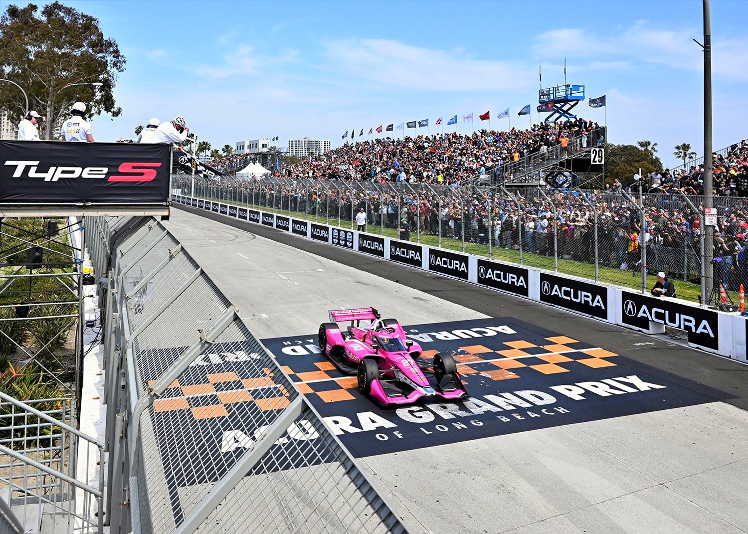 Kyle Kirkwood takes the checkered flag. Photo by Doug Clifford