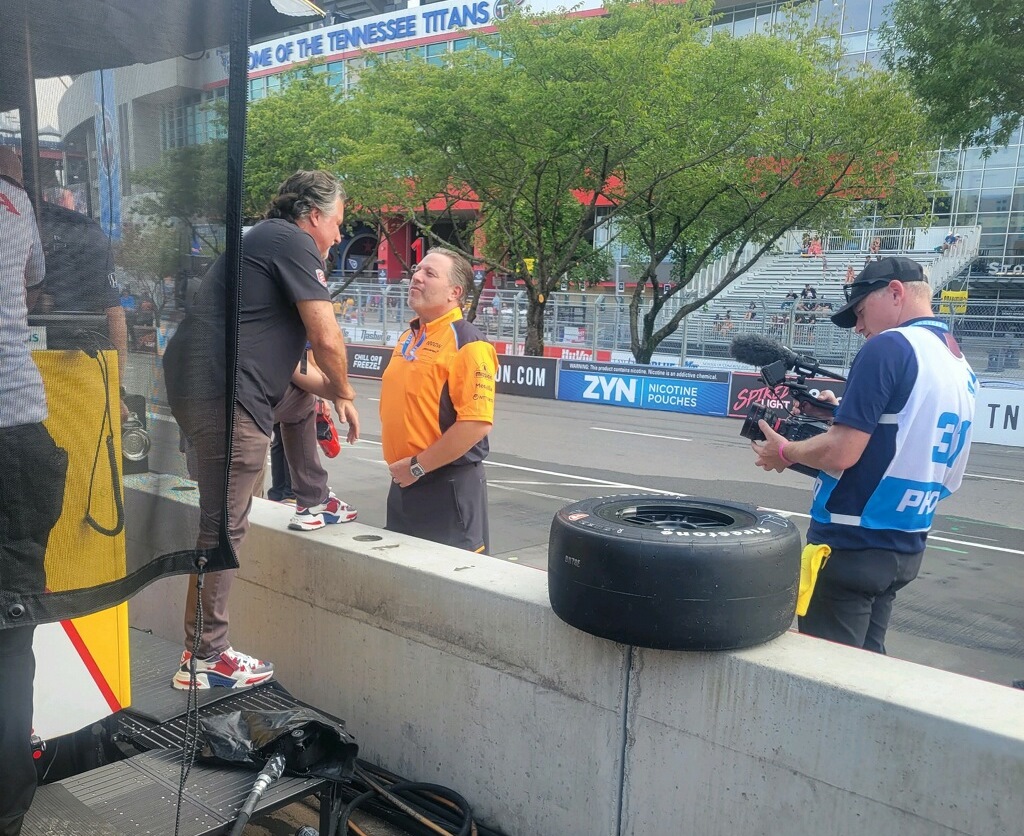 Andretti Autosport team owner Michael Andretti talks to Arrow McLaren IndyCar team owner and McLaren F1 CEO team owner Zak Brown at the Nashville IndyCar race Saturday August 5, 2023. Photo by Lucille Dust/AutoRacing1.com