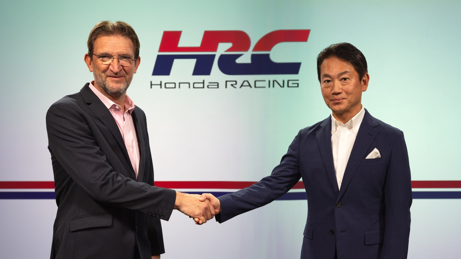 David Salters, president of HPD and Koji Watanabe, president of HRC Japan, shake on the merger