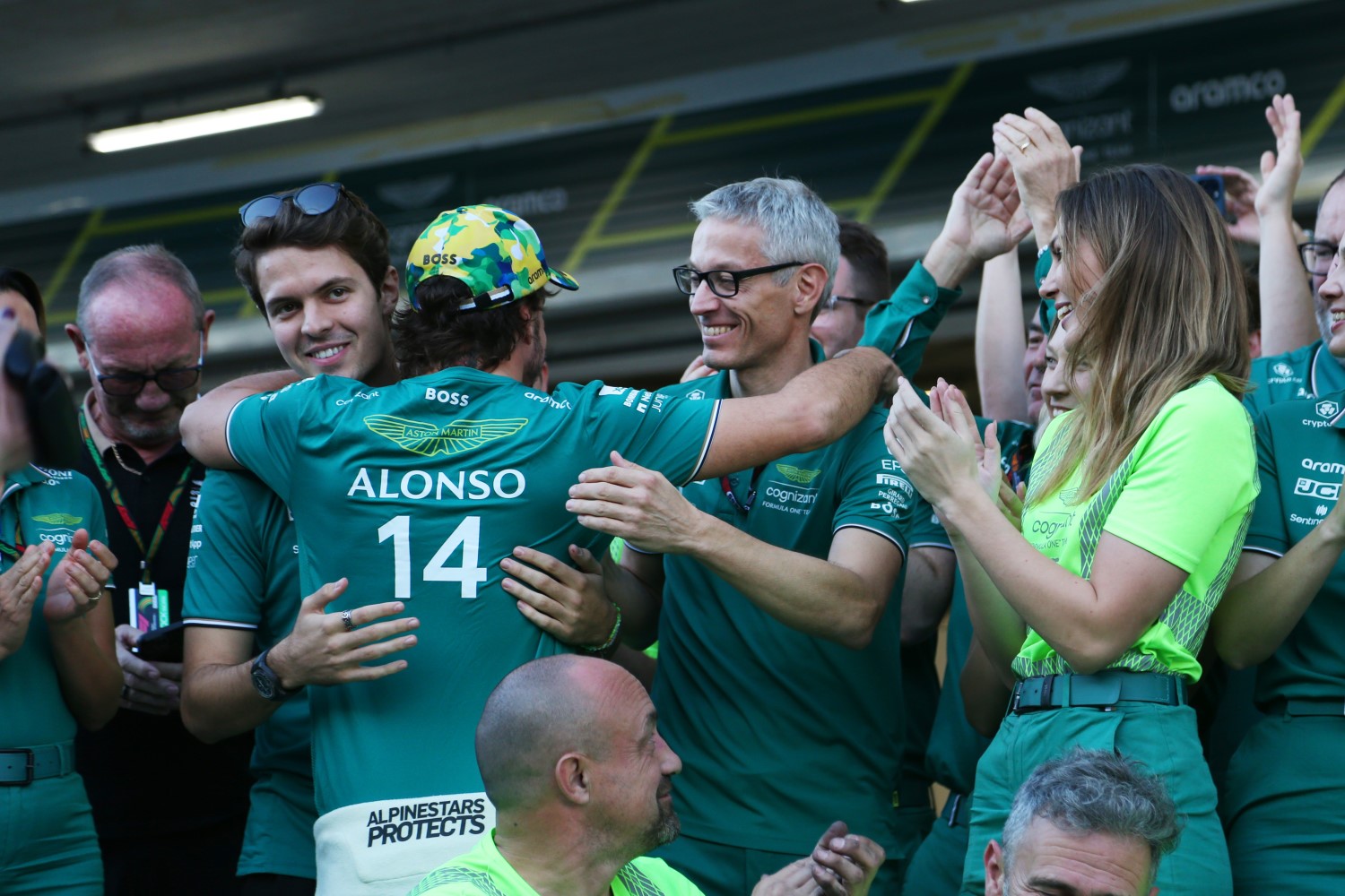 Felipe Drugovich, Reserve Driver, Aston Martin F1 Team, and Mike Krack, Team Principal, Aston Martin F1 Team, celebrate with Fernando Alonso, Aston Martin F1 Team, 3rd position, after the 2023 Sao Paulo GP race