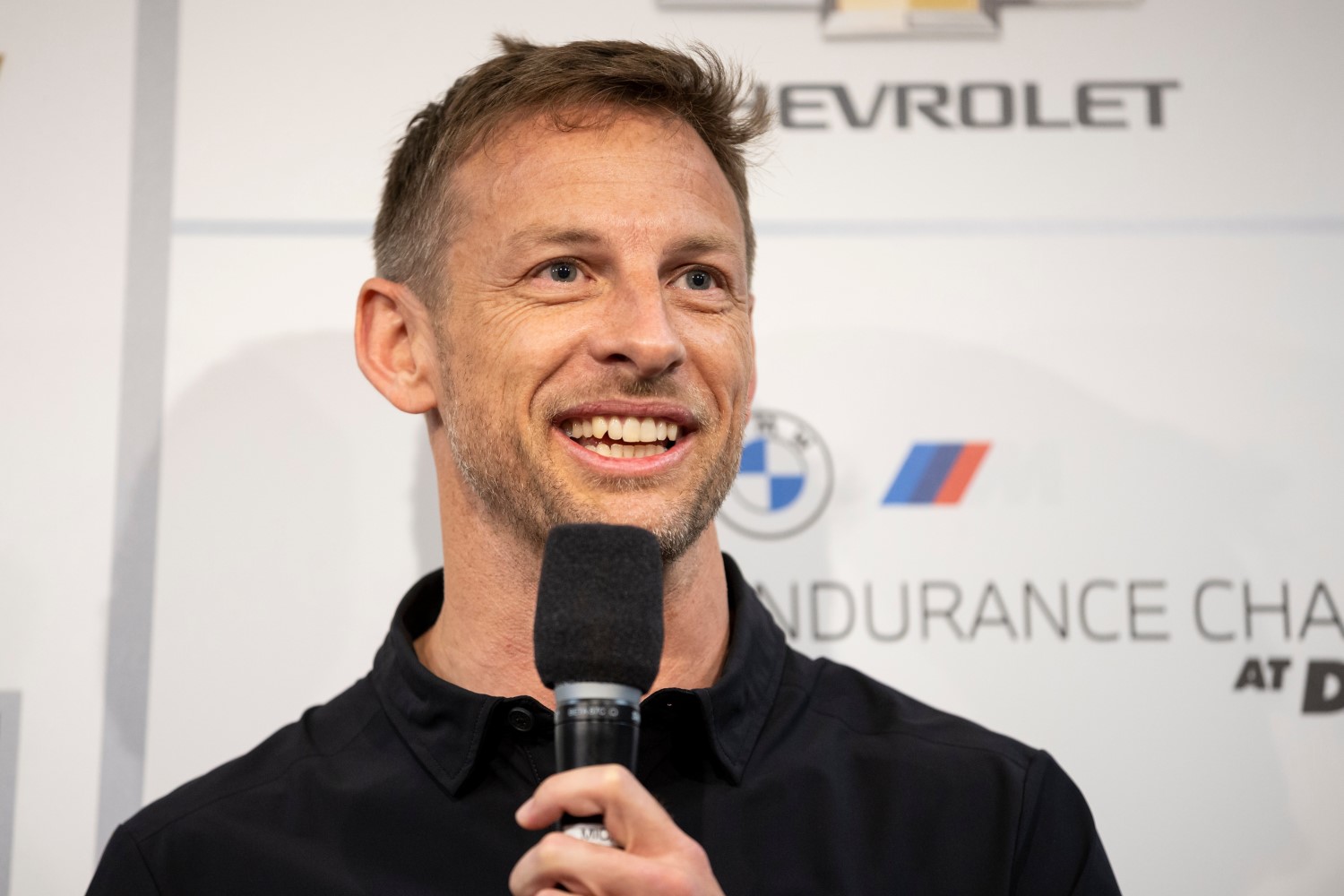 Jenson Button speaks to the Media during a press conference announcing the NASCAR Garage 56 driver lineup for entry in 2023 Le mans before the Rolex 24 at Daytona International Speedway on January 28, 2023 in Daytona Beach, Florida. (Photo by James Gilbert/Getty Images)