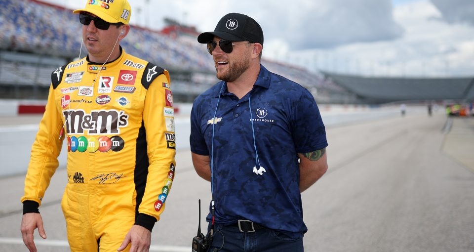 DARLINGTON, SOUTH CAROLINA - MAY 07: Kyle Busch, driver of the #18 M&M's Toyota, (L) and Trackhouse Racing team co-owner Justin Marks talk on the grid during qualifying for the NASCAR Cup Series Goodyear 400 at Darlington Raceway on May 07, 2022 in Darlington, South Carolina. (Photo by James Gilbert/Getty Images) | Getty Images for NASCAR