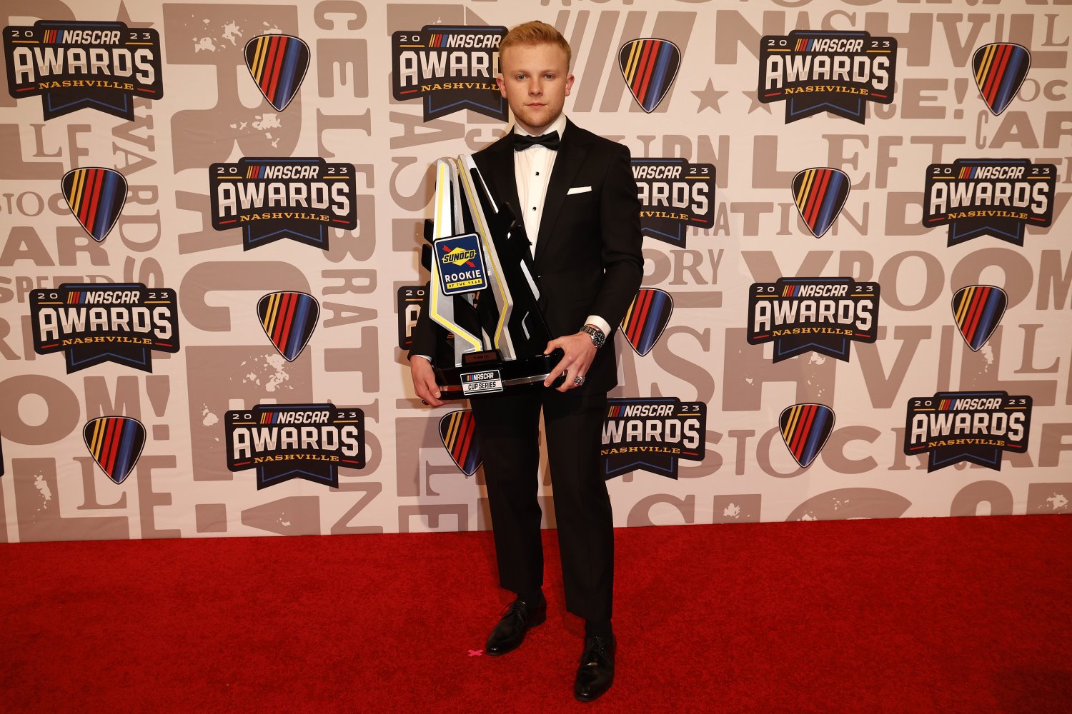 NASCAR Cup Series driver, Ty Gibbs poses for photos with the 2023 NASCAR Cup Series Sunoco Rookie of the Year trophy on the red carpet prior to the NASCAR Awards and Champion Celebration at the Music City Center on November 30, 2023 in Nashville, Tennessee. (Photo by Chris Graythen/Getty Images)