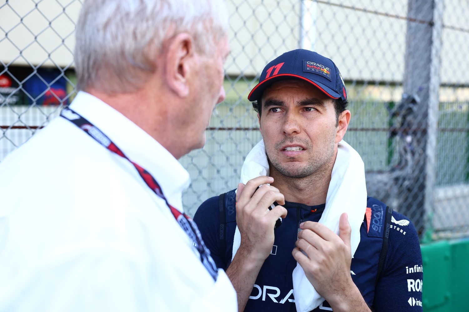 Sergio Perez of Mexico and Oracle Red Bull Racing talks with Red Bull Racing Team Consultant Dr Helmut Marko on the grid prior to the Sprint ahead of the F1 Grand Prix of Brazil at Autodromo Jose Carlos Pace on November 04, 2023 in Sao Paulo, Brazil. (Photo by Mark Thompson/Getty Images) // Getty Images / Red Bull Content Pool