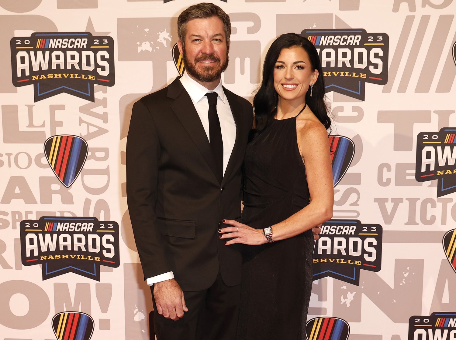 NASCAR Cup Series driver, Martin Truex Jr. and Emily Collins pose for photos on the red carpet prior to the NASCAR Awards and Champion Celebration at the Music City Center on November 30, 2023 in Nashville, Tennessee. (Photo by Chris Graythen/Getty Images)