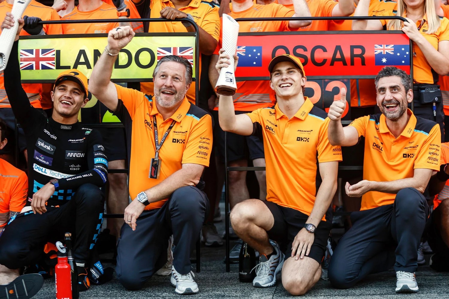 L to R: Lando Norris, Zak Brown, Oscar Piastri and Andrea Stella