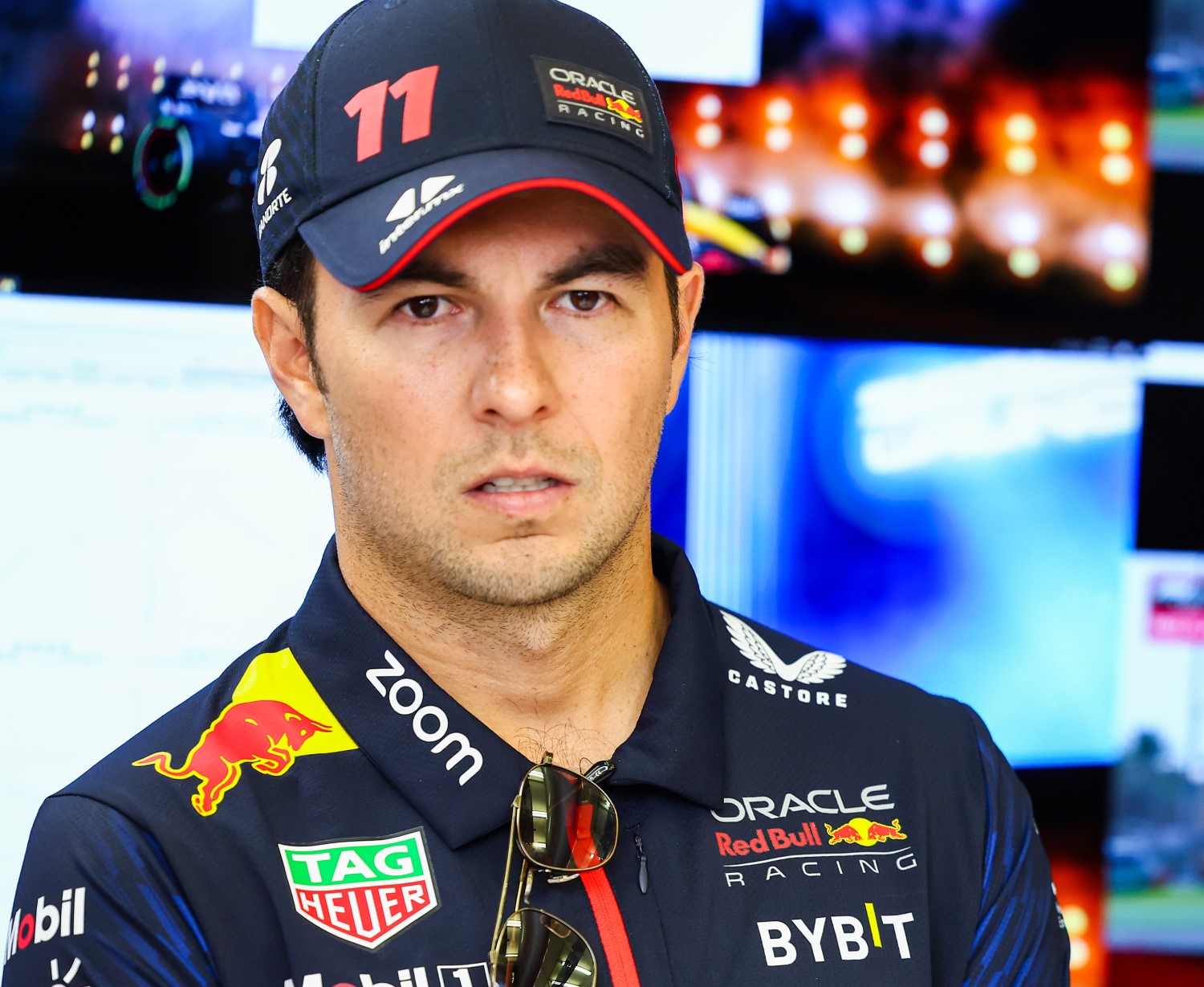 Sergio Perez of Mexico and Oracle Red Bull Racing looks on in the garage during day one of F1 Testing at Bahrain International Circuit on February 23, 2023 in Bahrain, Bahrain. (Photo by Mark Thompson/Getty Images) // Getty Images / Red Bull Content Pool