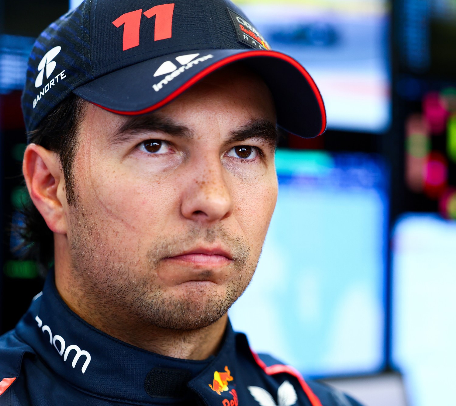 Sergio Perez of Mexico and Oracle Red Bull Racing looks on in the garage during day two of F1 Testing at Bahrain International Circuit on February 24, 2023 in Bahrain, Bahrain. (Photo by Mark Thompson/Getty Images) // Getty Images / Red Bull Content Pool
