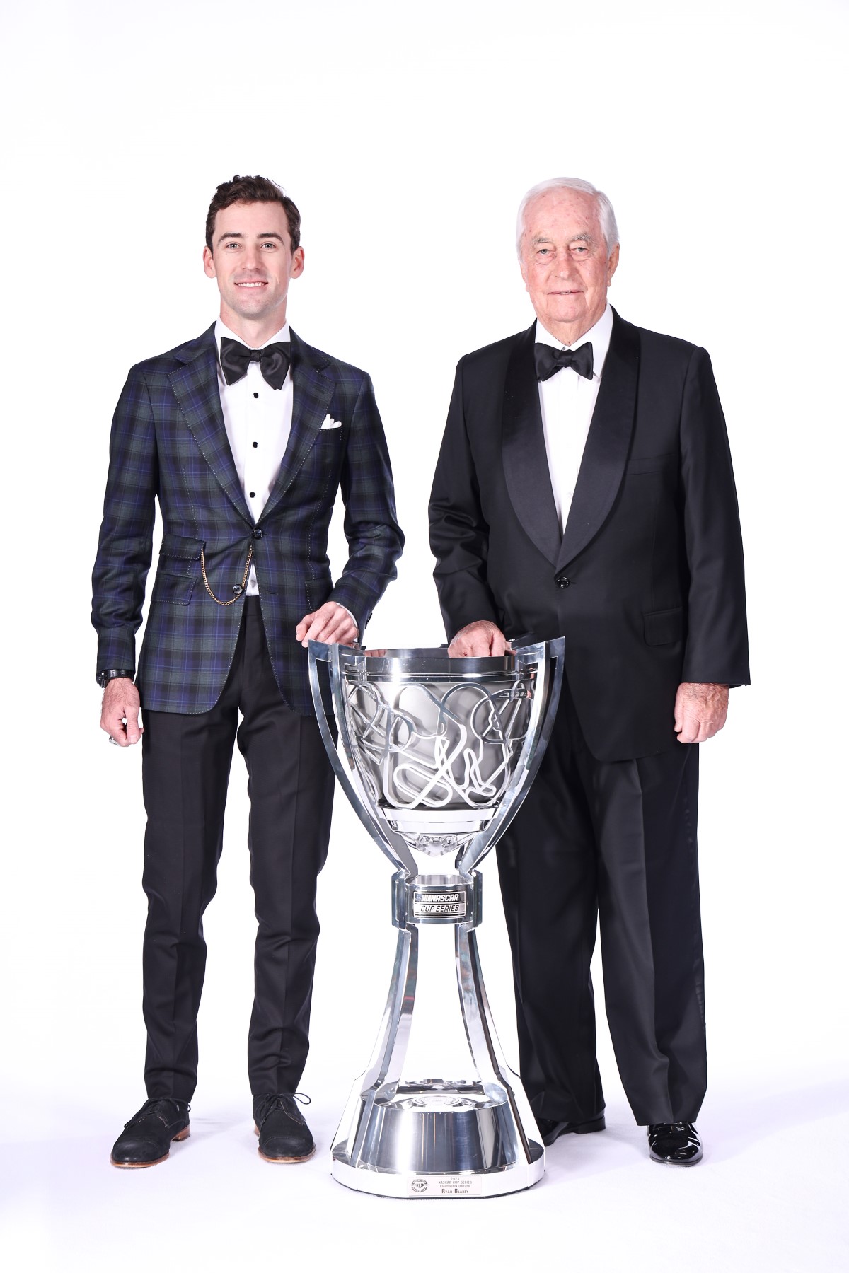 NASCAR Cup Series Champion, Ryan Blaney, and team owner, Roger Penske of Team Penske pose for photos with the Bill France NASCAR Cup Series Championship trophy prior to the NASCAR Awards and Champion Celebration at the Music City Center on November 30, 2023 in Nashville, Tennessee. (Photo by Jared C. Tilton/Getty Images)