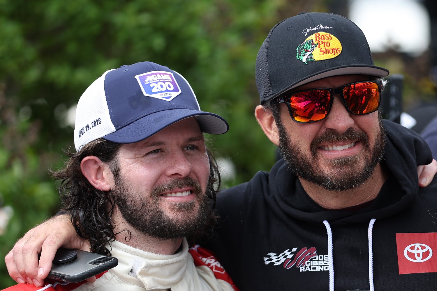 Ryan Truex, driver of the #19 Toyota Genuine Accessories Toyota, (L) is congratulated by his brother, NASCAR Series Cup driver, Martin Truex Jr. in victory lane after winning the NASCAR Xfinity Series A-GAME 200 at Dover International Speedway on April 29, 2023 in Dover, Delaware. (Photo by James Gilbert/Getty Images)