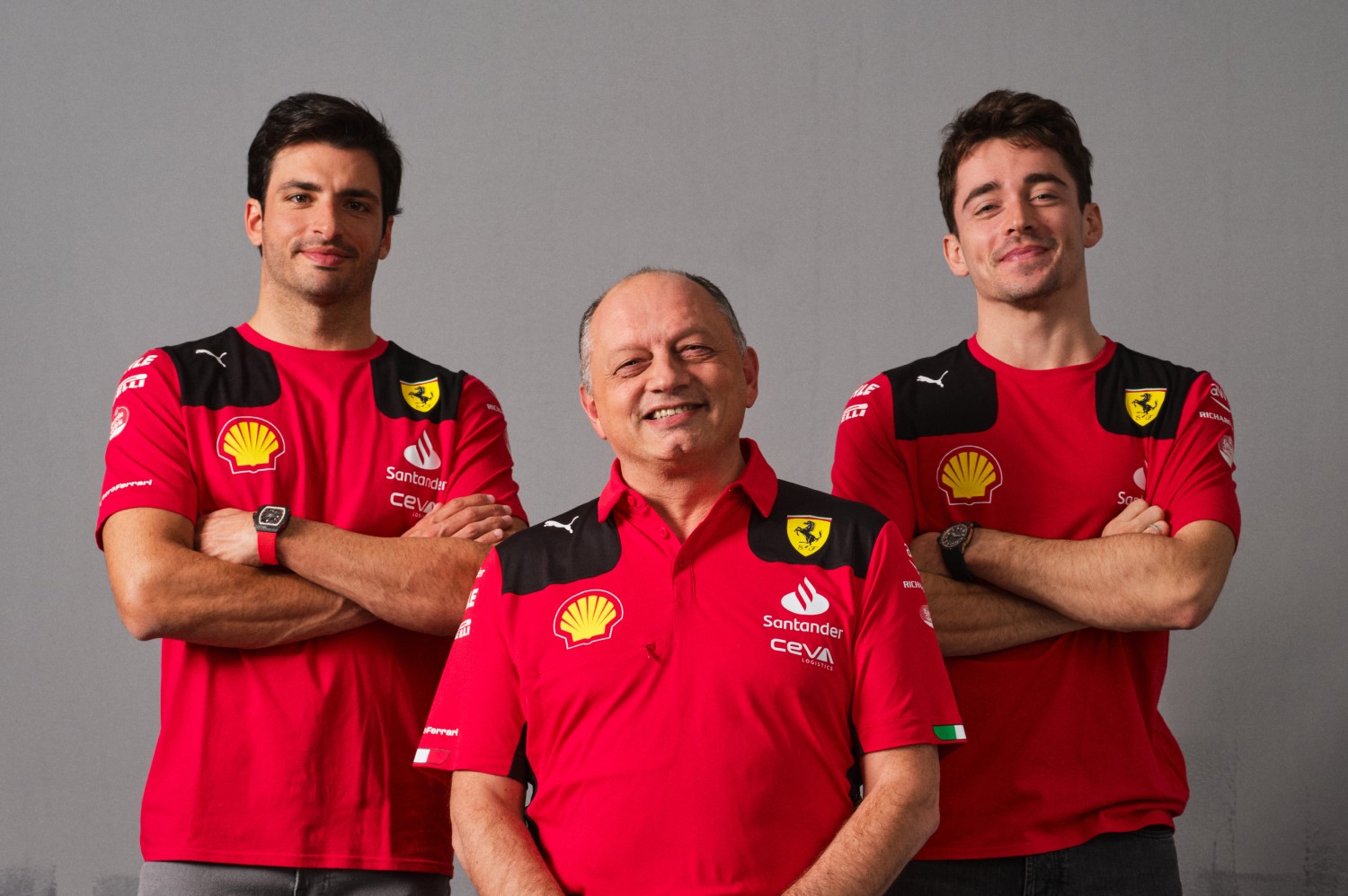 Ferrari F1 drivers Carlos Sainz Jr. and Charles Leclerc with Team Boss Fred Vasseur (C)
