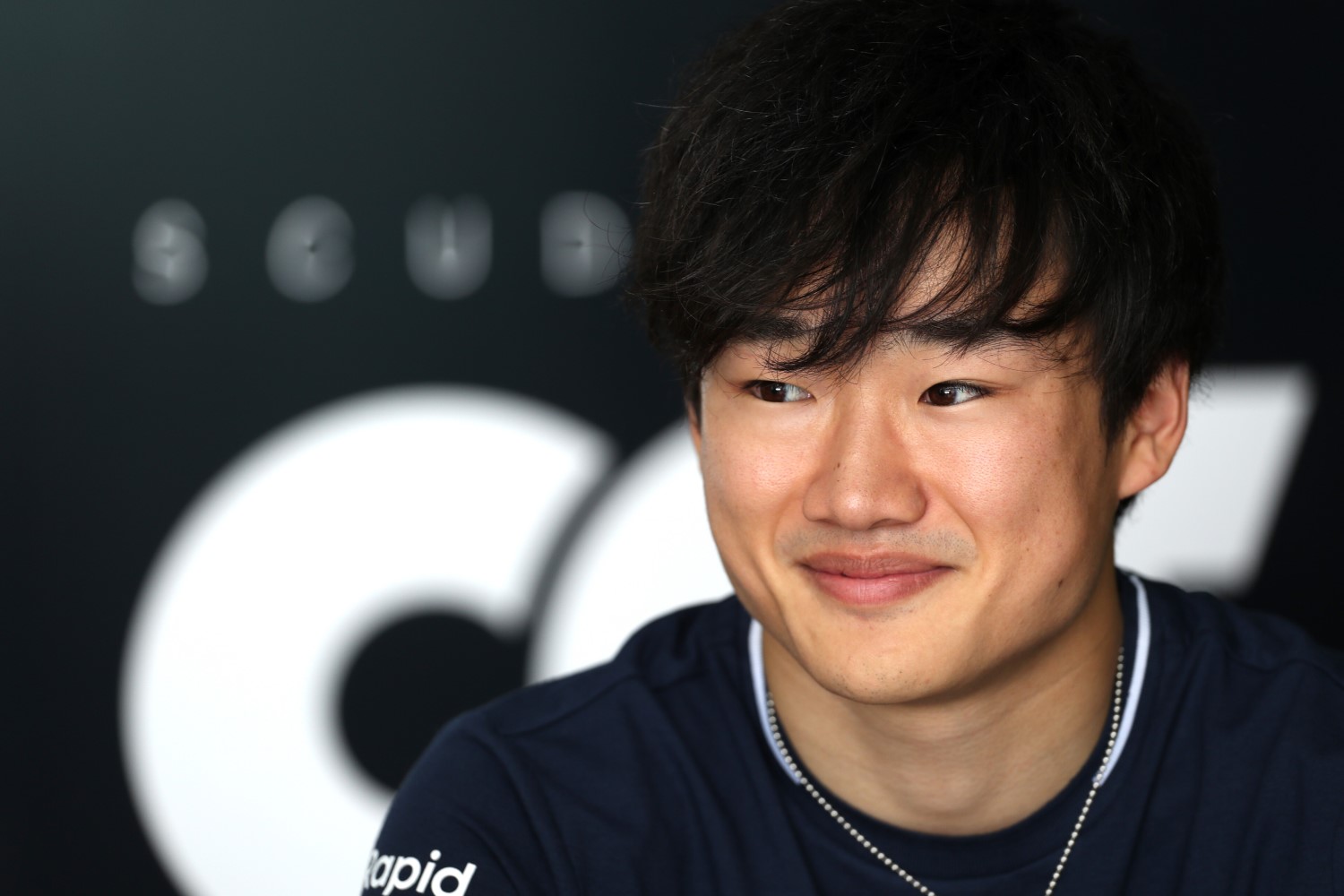 Yuki Tsunoda of Japan and Scuderia AlphaTauri talks to the media in the Paddock during previews ahead of the F1 Grand Prix of Saudi Arabia at Jeddah Corniche Circuit on March 16, 2023 in Jeddah, Saudi Arabia. (Photo by Peter Fox/Getty Images) // Getty Images / Red Bull Content Pool