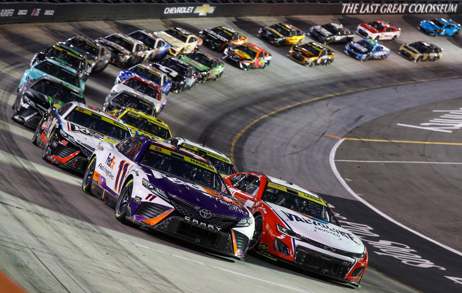 Denny Hamlin, driver of the #11 FedEx Freight Direct Toyota, and Kyle Larson, driver of the #5 Valvoline/Hendrickcars.com Chevrolet, lead the field during the NASCAR Cup Series Bass Pro Shops Night Race at Bristol Motor Speedway on September 16, 2023 in Bristol, Tennessee. (Photo by Meg Oliphant/Getty Images)