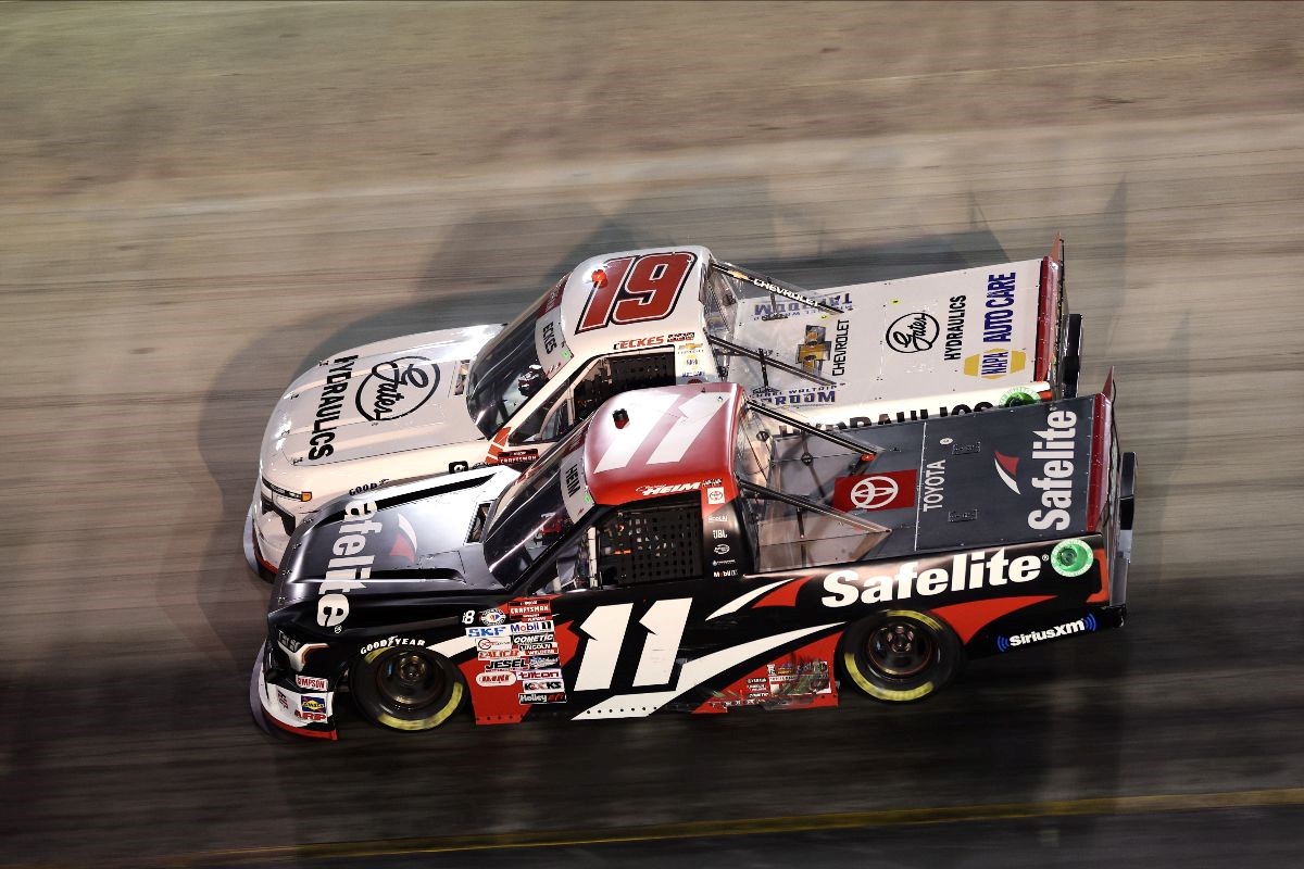 Corey Heim (11) pulled off a late race pass on leader Christian Eckes (19) to win Thursday night's UNOH 200 presented by Ohio Logistics at Bristol Motor Speedway.