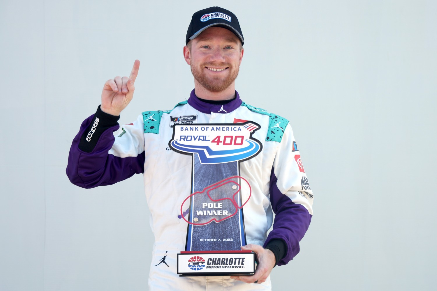 Tyler Reddick, driver of the #45 Jordan Brand Toyota, poses for photos with the Bank of America ROVAL 400 Pole Winner trophy during qualifying for the NASCAR Cup Series Bank of America ROVAL 400 at Charlotte Motor Speedway on October 07, 2023 in Concord, North Carolina. (Photo by Jared C. Tilton/Getty Images)