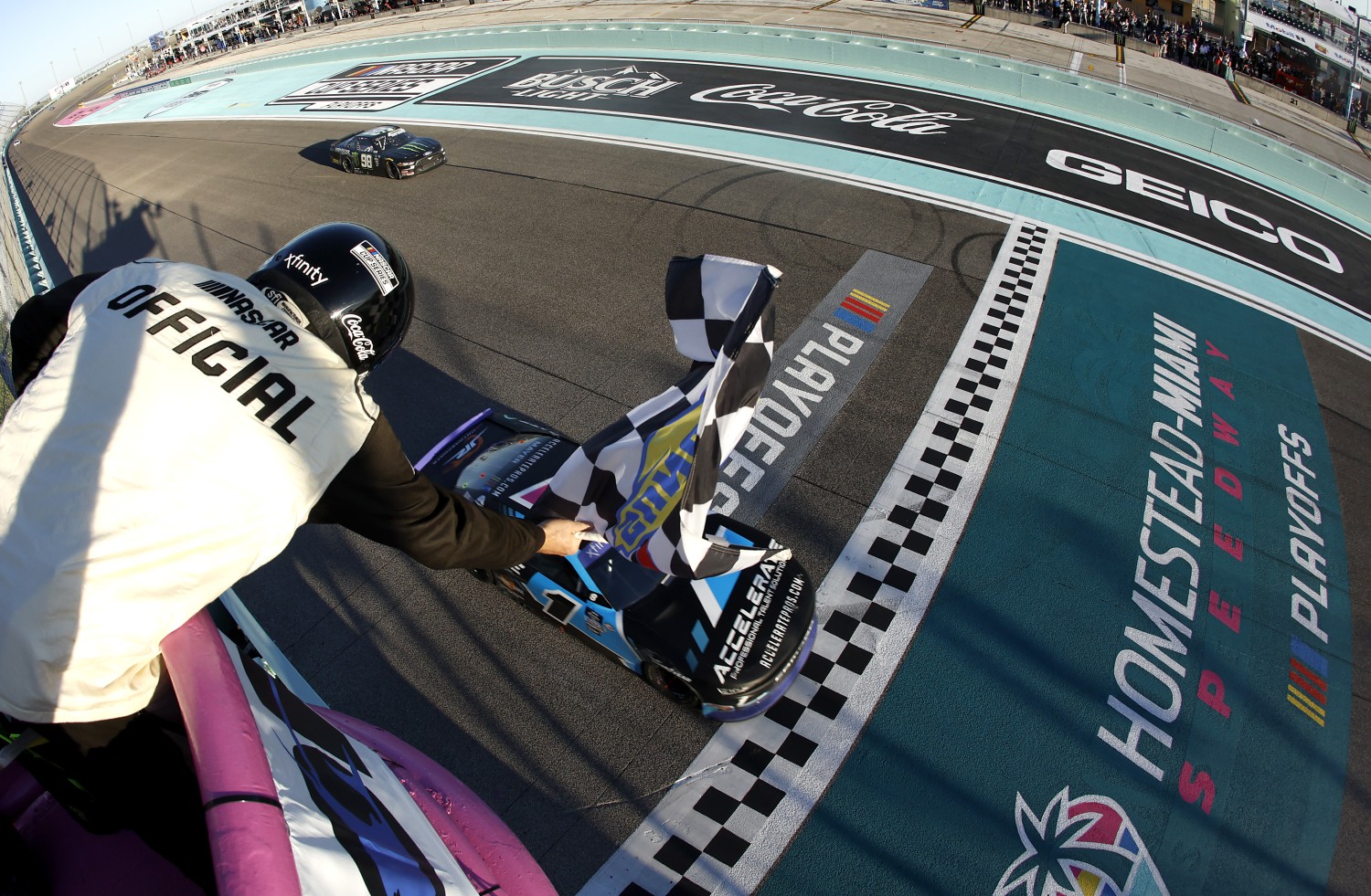 Sam Mayer, driver of the #1 Accelerate Pros Talent Chevrolet, takes the checkered flag to win the NASCAR Xfinity Series Contender Boats 300 at Homestead-Miami Speedway on October 21, 2023 in Homestead, Florida. (Photo by James Gilbert/Getty Images)