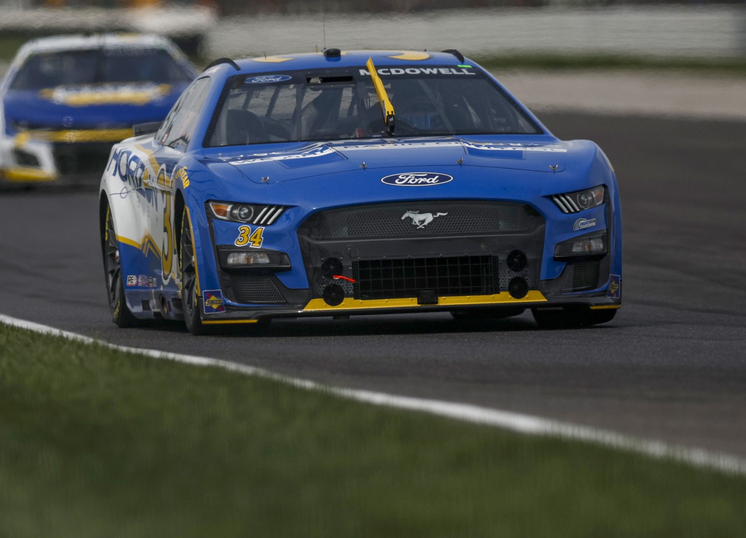 Michael McDowell, driver of the #34 Horizon Hobby Ford, leads the field during the NASCAR Cup Series Verizon 200 at the Brickyard at Indianapolis Motor Speedway on August 13, 2023 in Indianapolis, Indiana. (Photo by Sean Gardner/Getty Images)