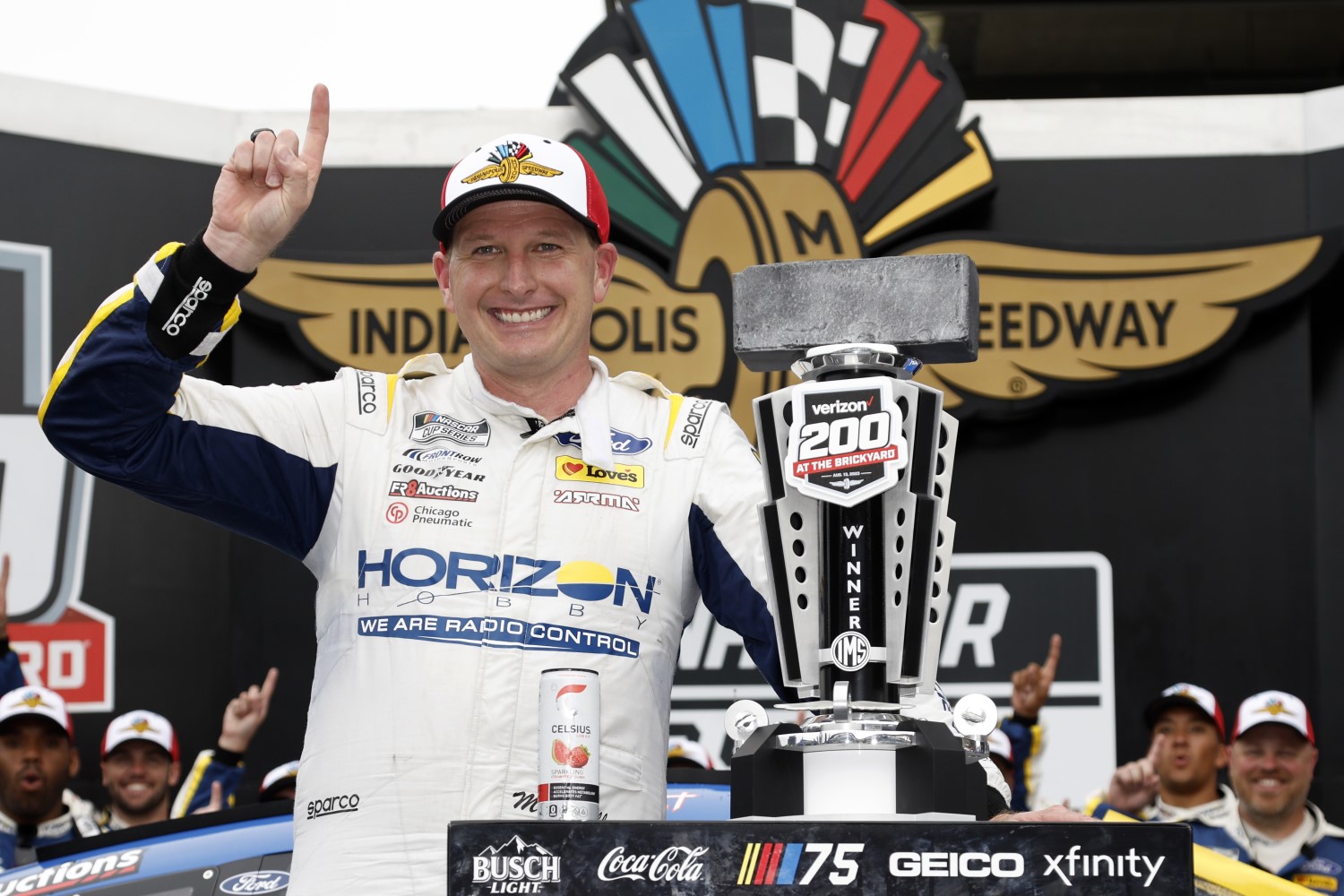 Michael McDowell, driver of the #34 Horizon Hobby Ford, celebrates in victory lane after winning the NASCAR Cup Series Verizon 200 at the Brickyard at Indianapolis Motor Speedway on August 13, 2023 in Indianapolis, Indiana. (Photo by Sean Gardner/Getty Images)