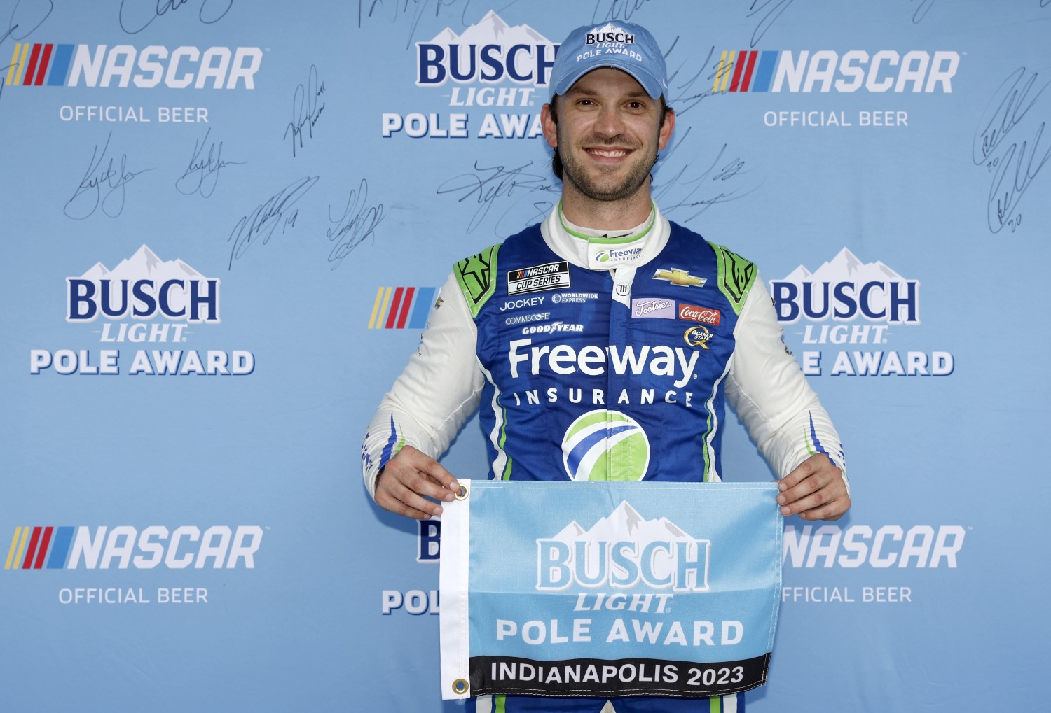 Daniel Suarez, driver of the #99 Freeway.com Chevrolet, poses for photos after winning the pole award during qualifying for the NASCAR Cup Series Verizon 200 at the Brickyard at Indianapolis Motor Speedway on August 12, 2023 in Indianapolis, Indiana. (Photo by Meg Oliphant/Getty Images)