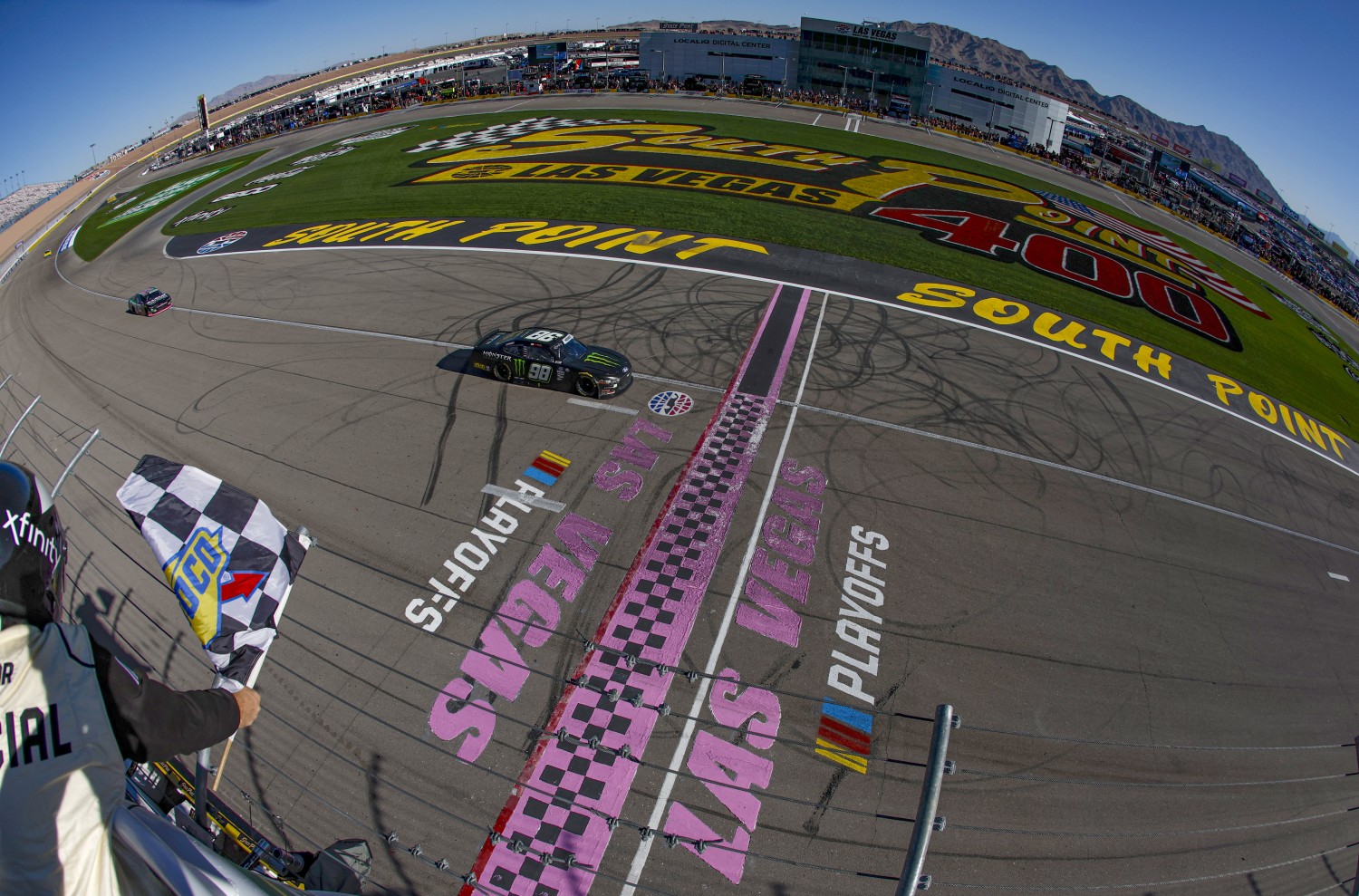 Riley Herbst, driver of the #98 Monster Energy Ford, takes the checkered flag to win the NASCAR Xfinity Series Alsco Uniforms 302 at Las Vegas Motor Speedway on October 14, 2023 in Las Vegas, Nevada. (Photo by Sean Gardner/Getty Images for NASCAR)