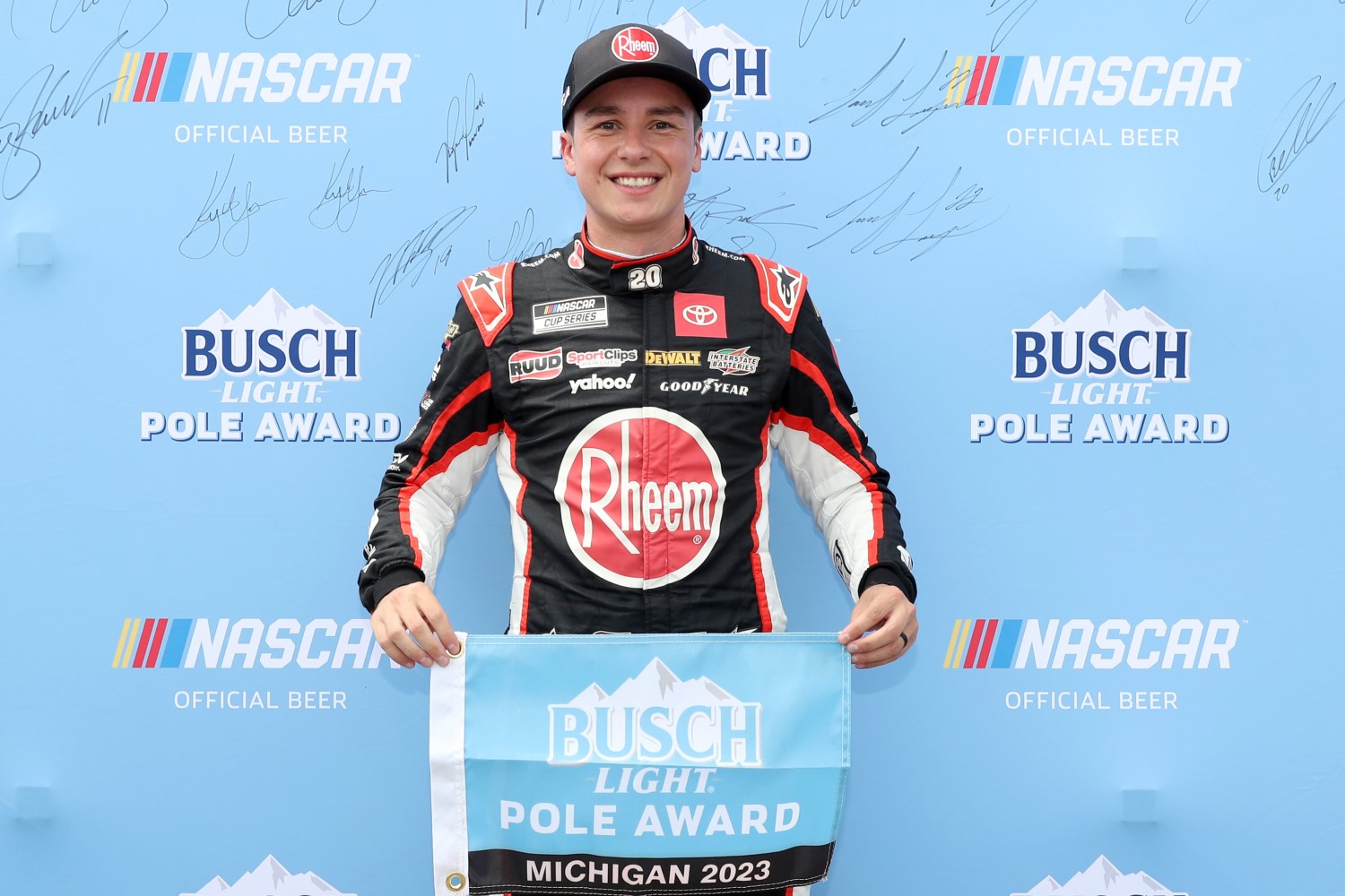 Christopher Bell, driver of the #20 Rheem Toyota, poses for photos after winning the pole award during qualifying for the NASCAR Cup Series FireKeepers Casino 400 at Michigan International Speedway on August 05, 2023 in Brooklyn, Michigan. (Photo by Meg Oliphant/Getty Images)