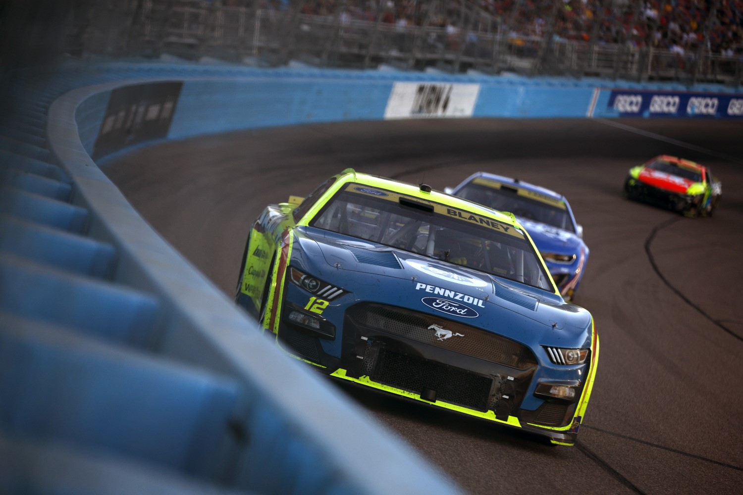 Ryan Blaney, driver of the #12 Menards/Dutch Boy Ford, Kyle Larson, driver of the #5 HendrickCars.com Chevrolet, and William Byron, driver of the #24 Axalta Chevrolet, race during the NASCAR Cup Series Championship at Phoenix Raceway on November 05, 2023 in Avondale, Arizona. (Photo by Sean Gardner/Getty Images)